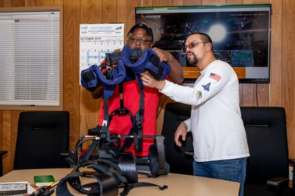 Code 900F.12 Safety Repair Work Leader Daniel Freeney Sr. and his team test the weight and design of the Levitate Airframe exoskeleton suit.