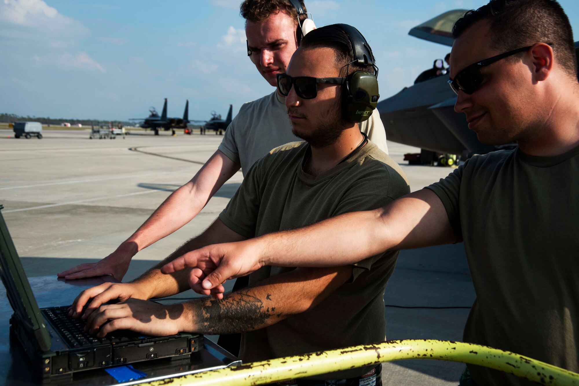Maintenance Airmen support pre-flight aircraft operations on the flight line Nov. 6, 2019, at Tyndall Air Force Base, Florida. Tyndall supported Checkered Flag 20-1, which is a large-scale aerial exercise designed to integrate fourth and fifth-generation airframes to enhance mobility, deployment, and employment capabilities of aviators and maintainers. The exercise involved airpower assets, more than 50 aircraft, and support personnel from multiple installations. Aircraft and pilots participated in a Weapons System Evaluation Program and are evaluated on air-to-air and air-to-ground operations, providing a unique training environment. (U.S. Air Force photo by Staff Sgt. Magen M. Reeves)