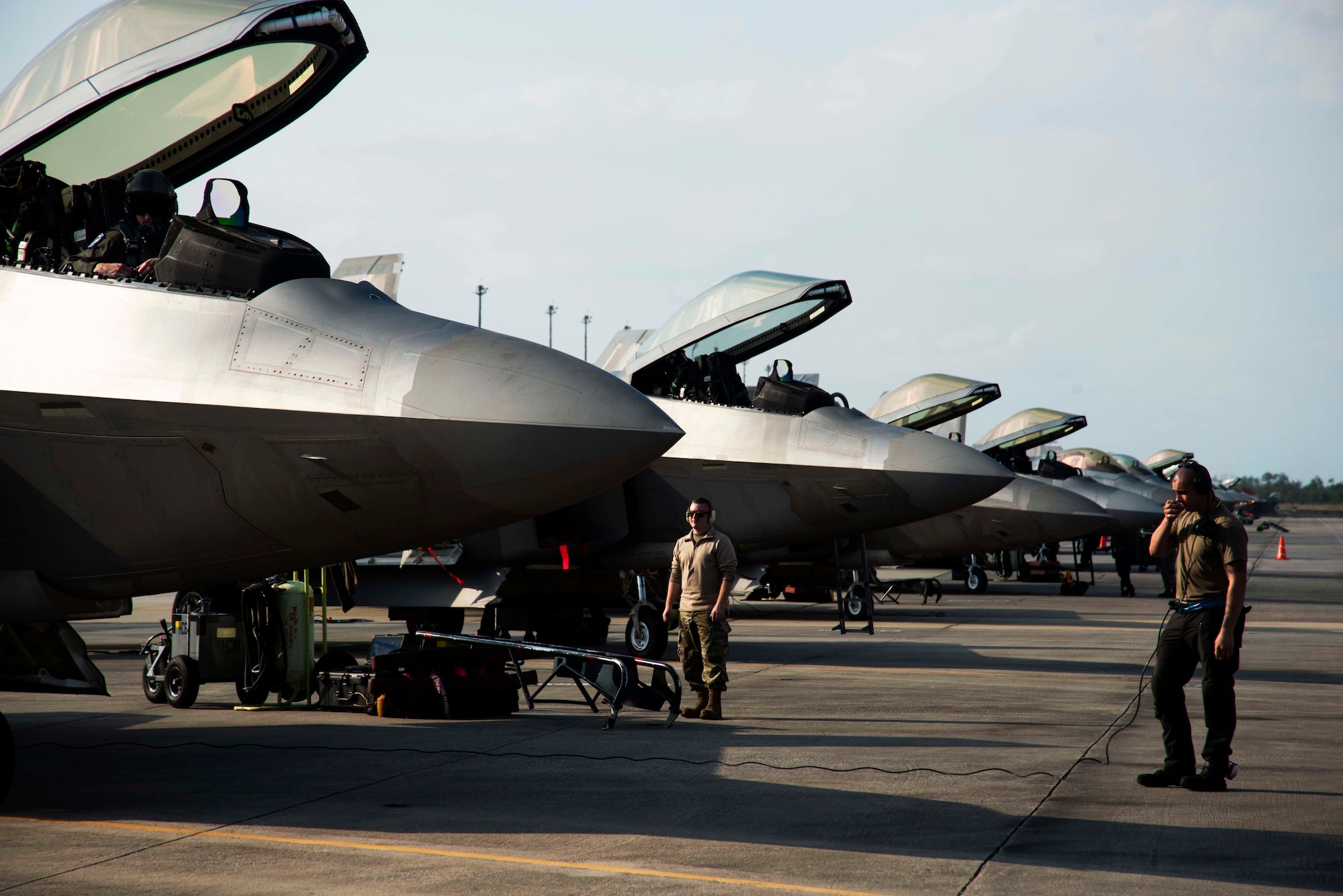The aircrew assigned to an F-22 Raptor perform maintenance checks Nov. 6, 2019, at Tyndall Air Force Base, Florida. The pilot, airframe, and maintenance team supported Checkered Flag 20-1, which is a large-scale aerial exercise designed to integrate fourth and fifth-generation airframes to enhance mobility, deployment, and employment capabilities of aviators and maintainers. The exercise involved airpower assets, more than 50 aircraft, and support personnel from multiple installations. Aircraft and pilots participated in a Weapons System Evaluation Program and are evaluated on air-to-air and air-to-ground operations, providing a unique training environment. (U.S. Air Force photo by Staff Sgt. Magen M. Reeves)