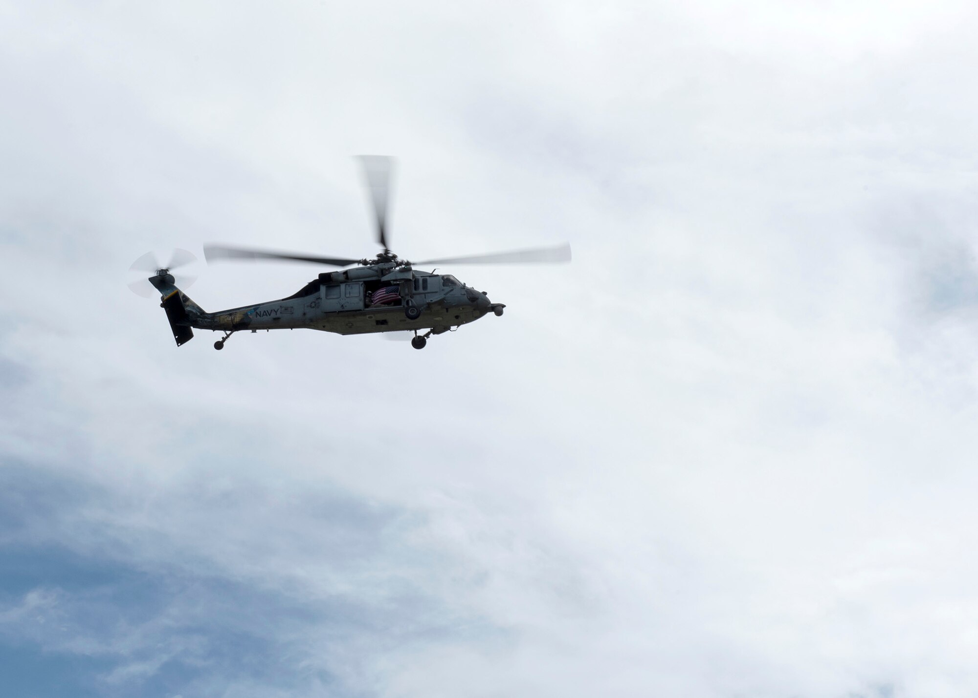 A H-60 from the Helicopter Sea Combat Squadron 25 (HSC 25) “Island Knights” kicks off the Veterans Day ceremony with a flyover Nov 11, at Ypao Beach, Guam. The Veterans Day ceremony celebrated the service of all U.S. military veterans and coincides with Armistice Day and Remembrance Day which are celebrated in other countries, marking the anniversary of the end of World War I.