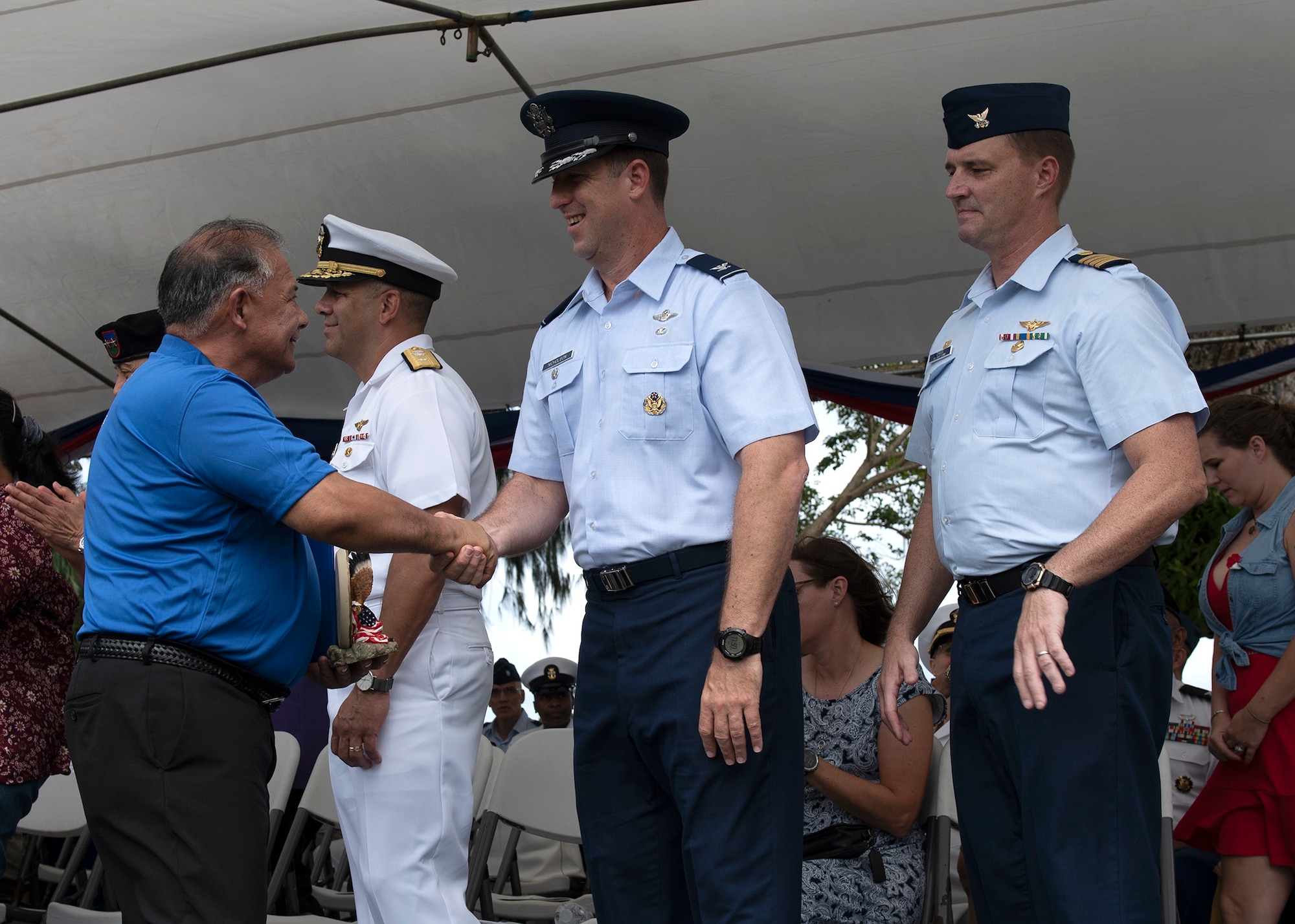 (Center) Col. Matthew Nicholson, 36th Wing Vice Commander, congratulates veteran Capt. Anthony Damian Quenga King (left) for receiving the Guam “Veteran of the Year” award during the Veterans day ceremony at Ypao Beach, Guam Nov 11. Veterans Day celebrates the service of all U.S. military veterans and coincides with Armistice Day and Remembrance Day which are celebrated in other countries, marking the anniversary of the end of World War I.