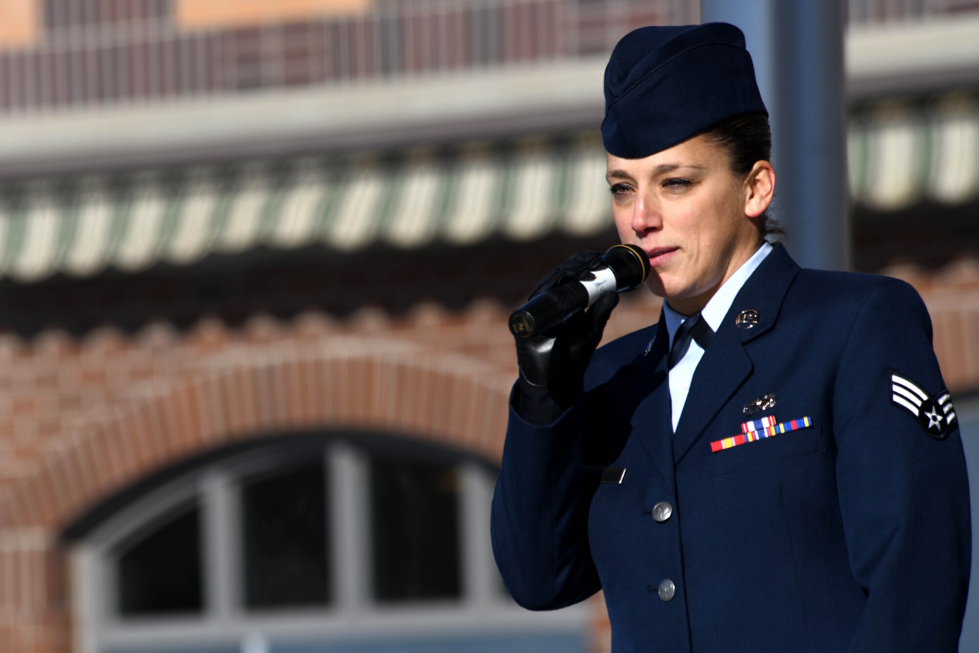 Senior Airman Rachael Karpo, 28th Operations Support Squadron Air Traffic Controller, speaks at the 2019 Veteran’s Day Ceremony at Main Street Square in Rapid City, S.D., Nov. 11, 2019. Karpo sang the National Anthem as an opener for the ceremony and provided an anecdote of her military service to those in attendance. (U.S. Air Force photo by Staff Sgt. Hailey Staker)