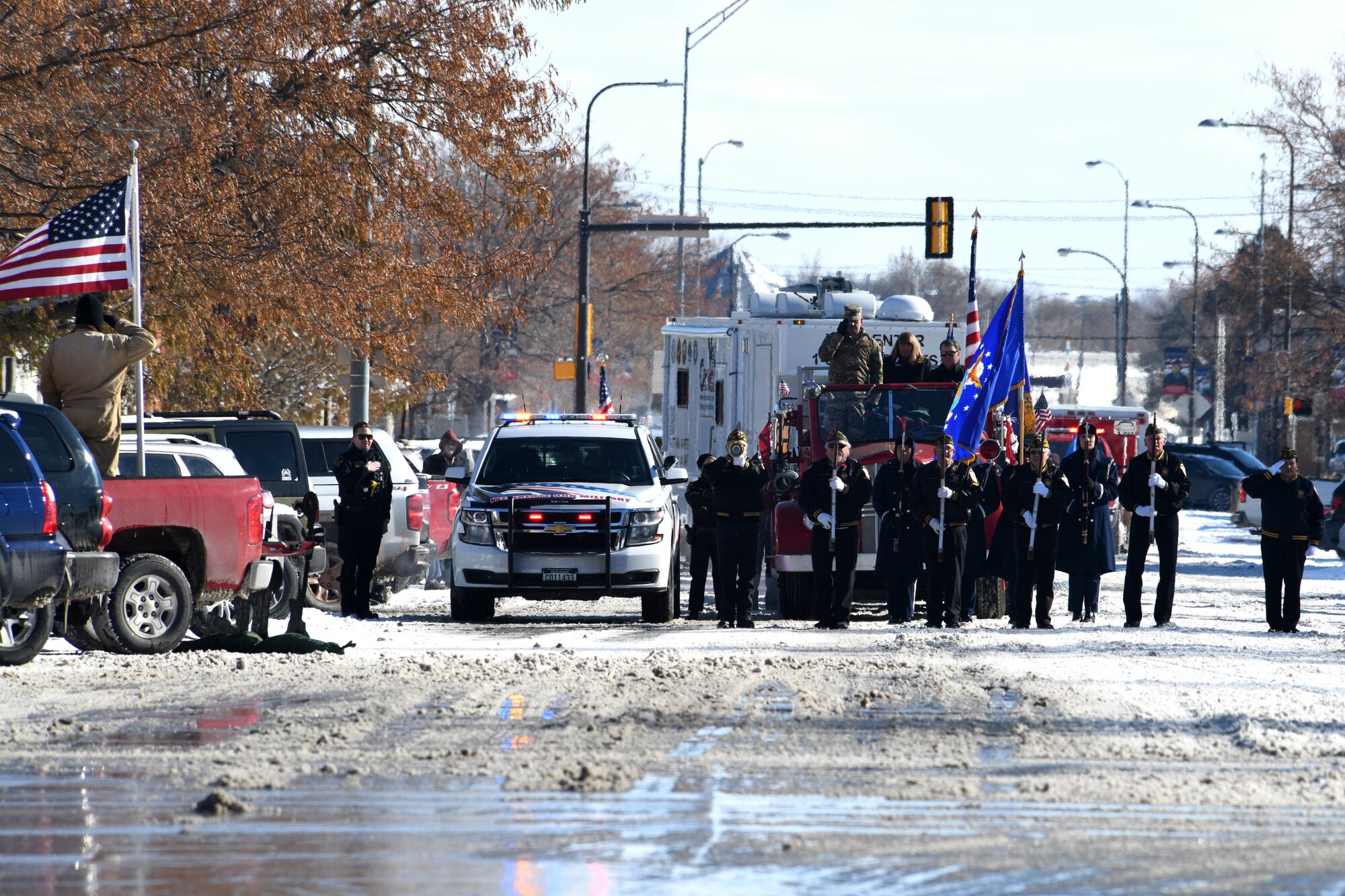 The 2019 Veteran’s Day Parade begins on Main Street in Rapid City, S.D., Nov. 11, 2019. The Ellsworth Air Force Base Honor Guard presented the colors during the playing of Taps, while the 28th Bomb Wing commander and veterans saluted the flag. (U.S. Air Force photo by Staff Sgt. Hailey Staker)