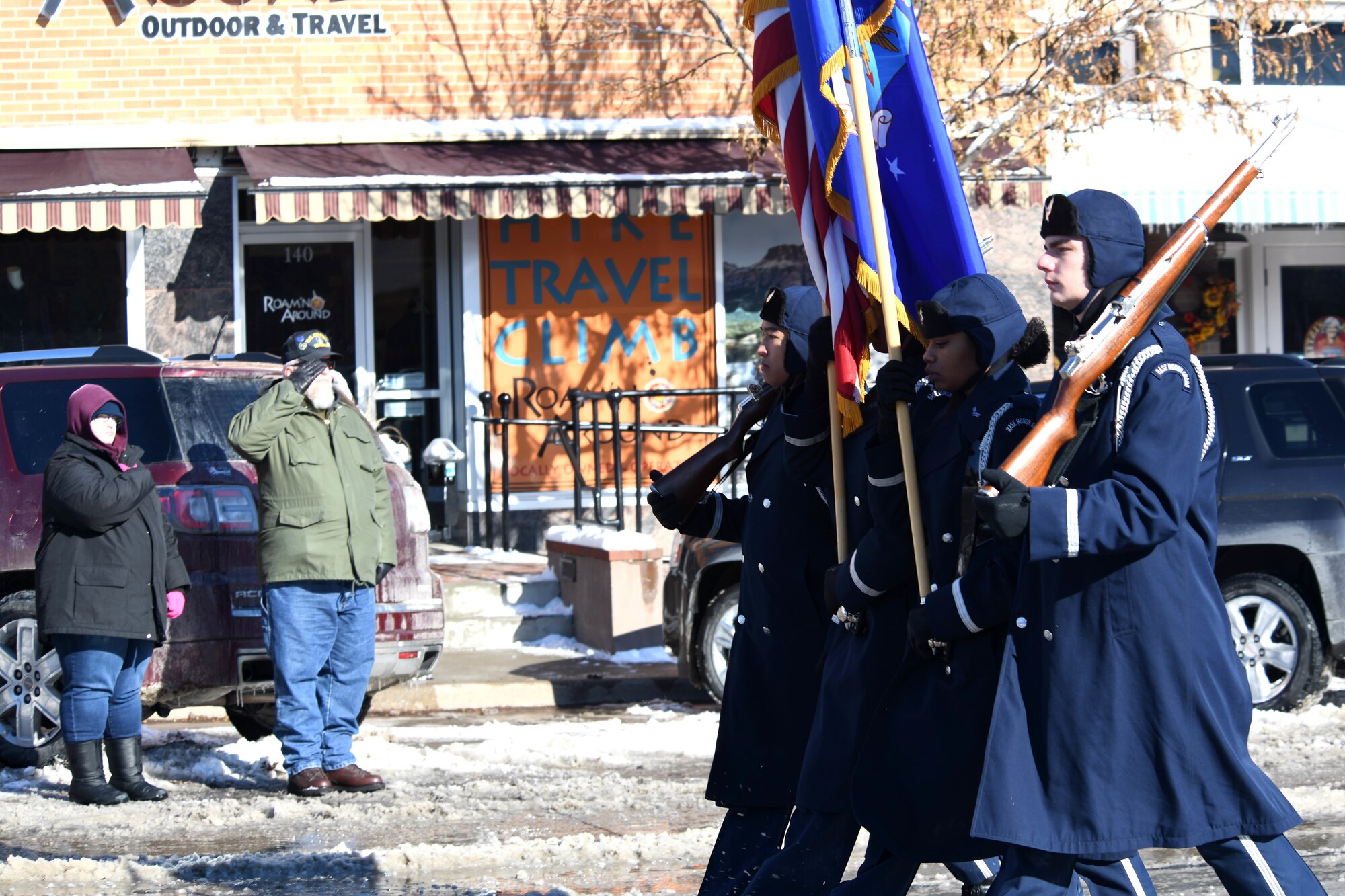 A veteran salutes the flag as the Ellsworth Air Force Base, S.D., Honor Guard walks in the 2019 Veteran’s Day Parade on Main Street in Rapid City, S.D., Nov. 11, 2019. The Veteran’s Day Ceremony and Parade celebrate and honor the nation’s veterans, and included a flag ceremony by the Honor Guard. (U.S. Air Force photo by Staff Sgt. Hailey Staker)