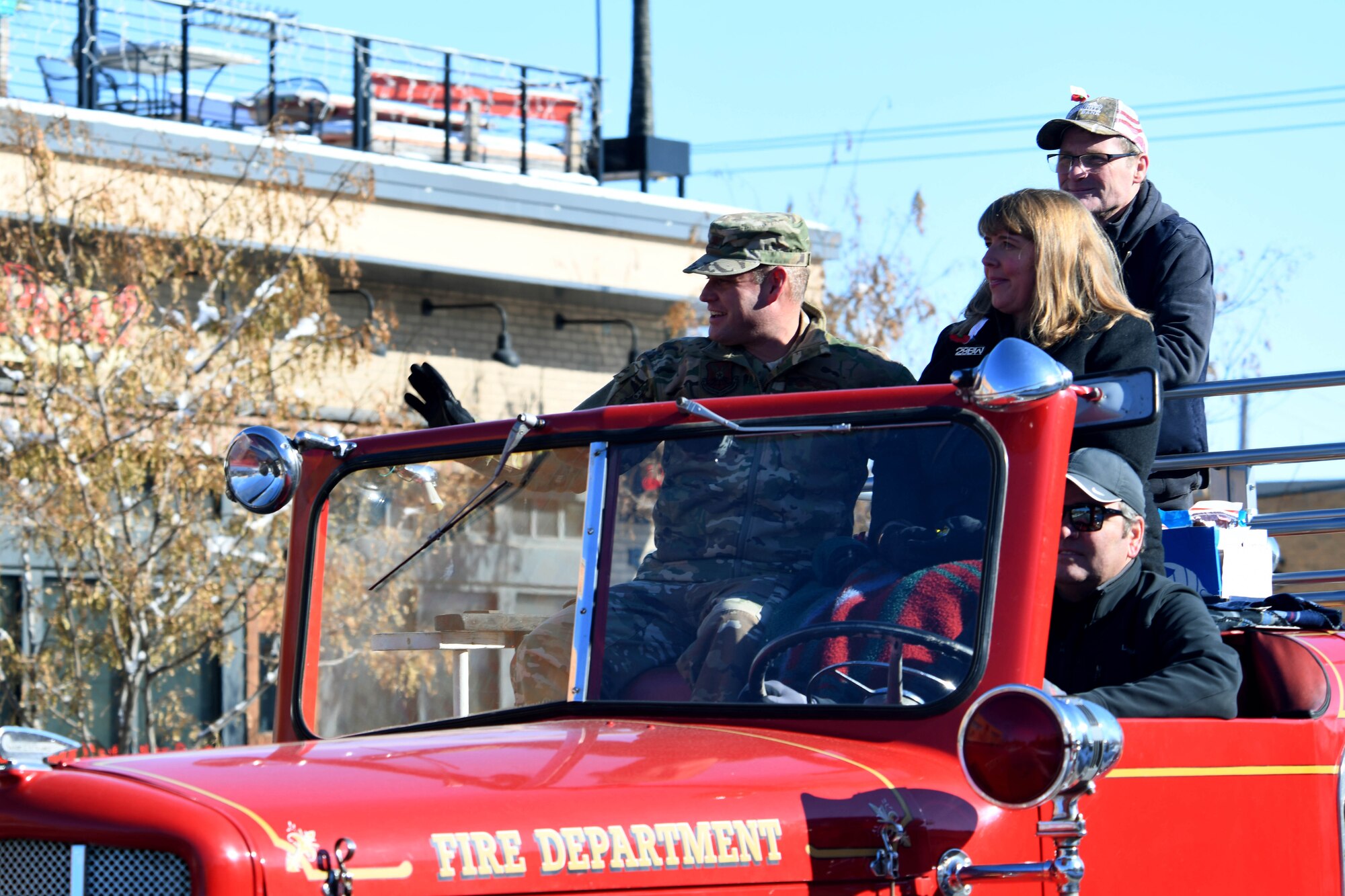 Col. David A. Doss, 28th Bomb Wing commander, and his spouse, Marlina, ride in the flagship fire truck during the 2019 Veteran’s Day Parade on Main Street in Rapid City, S.D., Nov. 11, 2019. The Veteran’s Day Ceremony and Parade celebrate and honor our nation’s veterans, and included a flag ceremony by the Honor Guard. (U.S. Air Force photo by Staff Sgt. Hailey Staker)