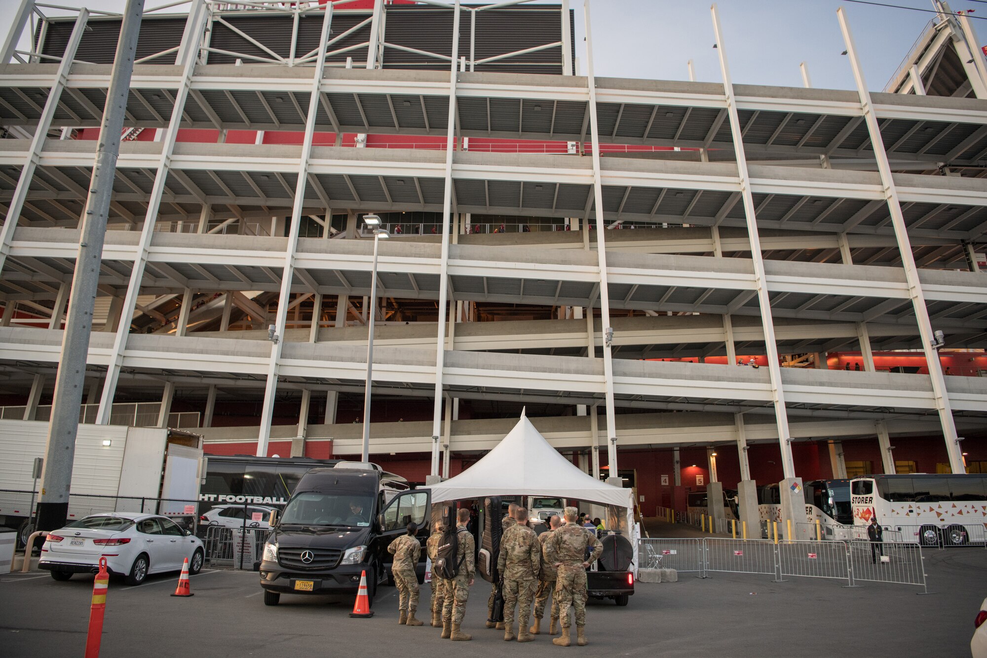 U.S. Air Force Band of the Golden West’s Mobility Rock Band from Travis Air Force Base, California, is escorted to their greenroom