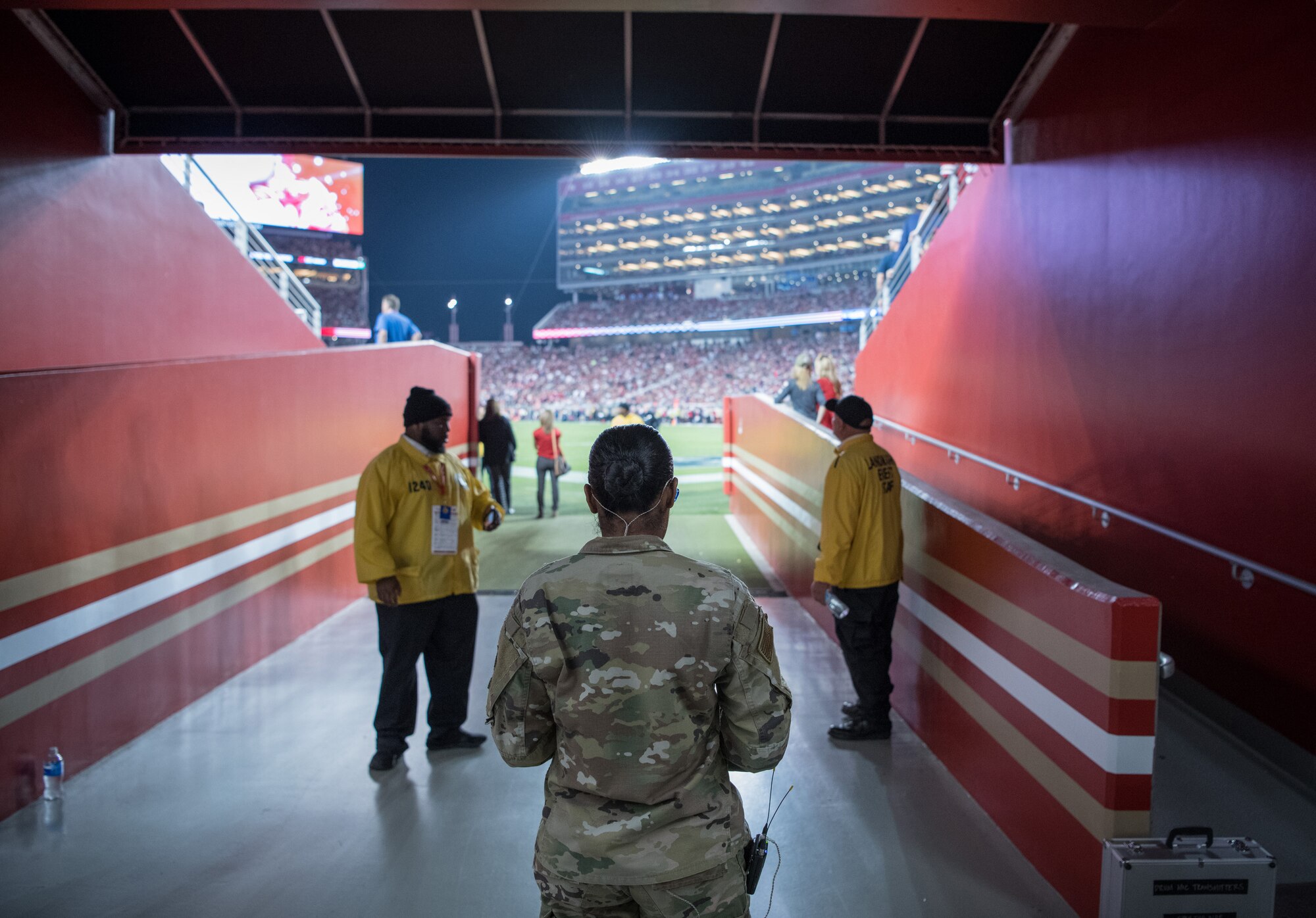 A U.S. Airman walks through a tunnel at Levi Stadium.