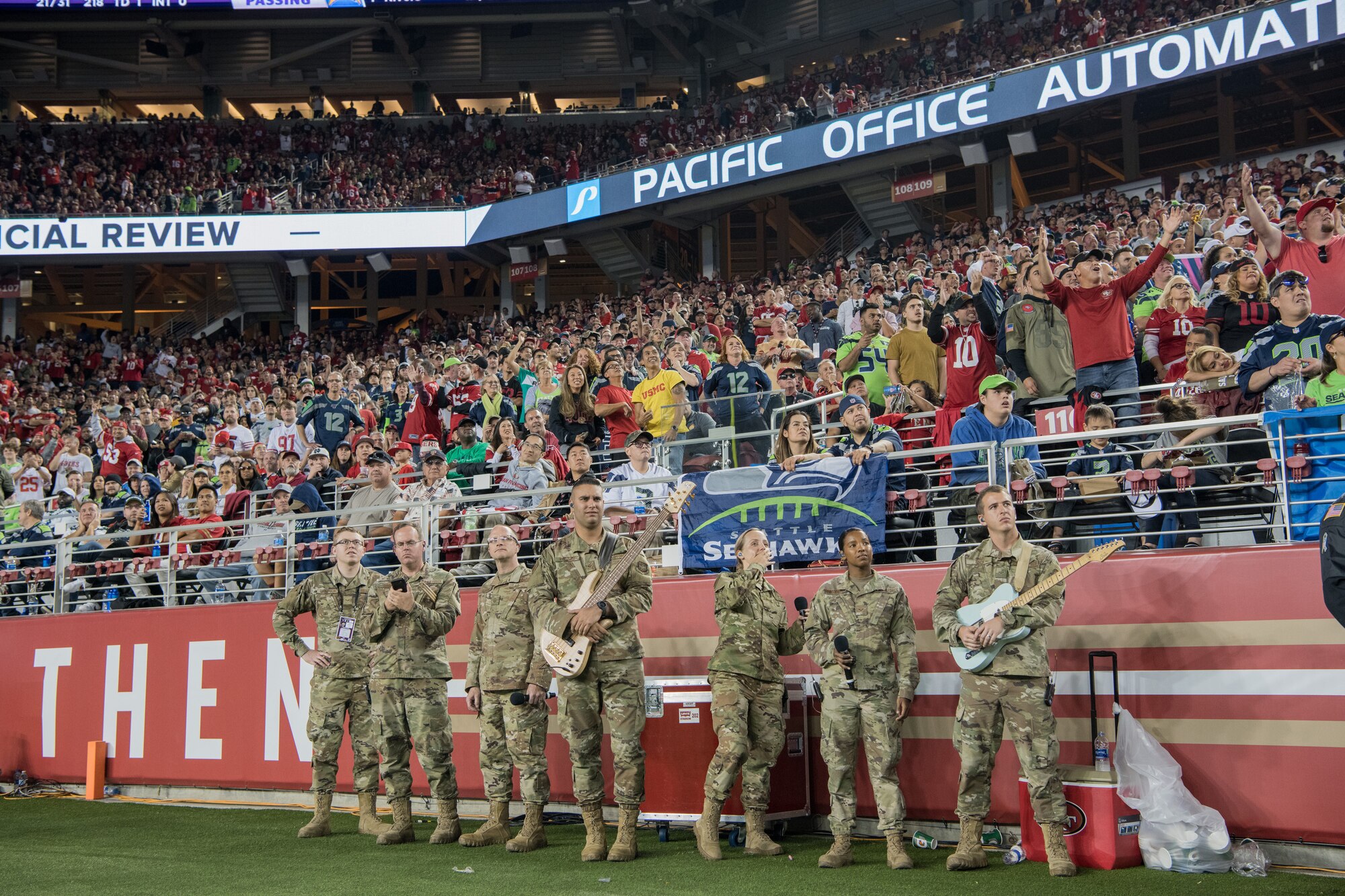 U.S. Air Force Band of the Golden West’s Mobility Rock Band from Travis Air Force Base, California, waits on the sideline