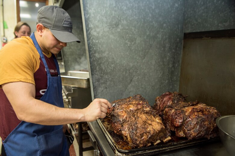 U.S. Army Sgt. Nelson Leiva, 626th Quartermaster Field Feeding Company noncommissioned officer, checks the temperature of meat at the Eagle River VFW, Alaska, Nov. 9, 2019. The purpose of the event was to honor those who served in the military. Soldiers from the 9th Army Band and culinary specialist from the 626th Quartermaster Field Feeding Company volunteered to support the ceremony. Soldiers from the 626th Quartermaster have volunteered more than 100 hours to the Eagle River VFW.