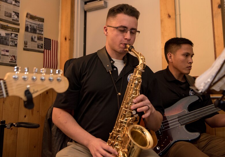U.S. Army Spc. Joseph May, 9th Army Band saxophonist, performs a solo at the Eagle River VFW, Alaska, Nov. 9, 2019. The purpose of the event was to honor those who served in the military. Soldiers from the 9th Army Band and culinary specialist from the 626th Quartermaster Field Feeding Company volunteered to support the ceremony. Soldiers from the 626th Quartermaster have volunteered more than 100 hours to the Eagle River VFW.