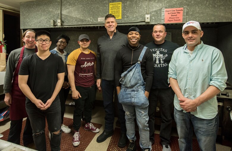 In the center, U.S. Army Maj. Gen. Peter Andrysiak, U.S. Army Alaska commander, and Soldiers from the 626th Quartermaster Field Feeding Company, pose for a photo at the Eagle River VFW, Alaska, Nov. 9, 2019. The purpose of the event was to honor those who served in the military. Soldiers from the 9th Army Band and culinary specialist from the 626th Quartermaster Field Feeding Company volunteered to support the ceremony. Soldiers from the 626th Quartermaster have volunteered more than 100 hours to the Eagle River VFW.