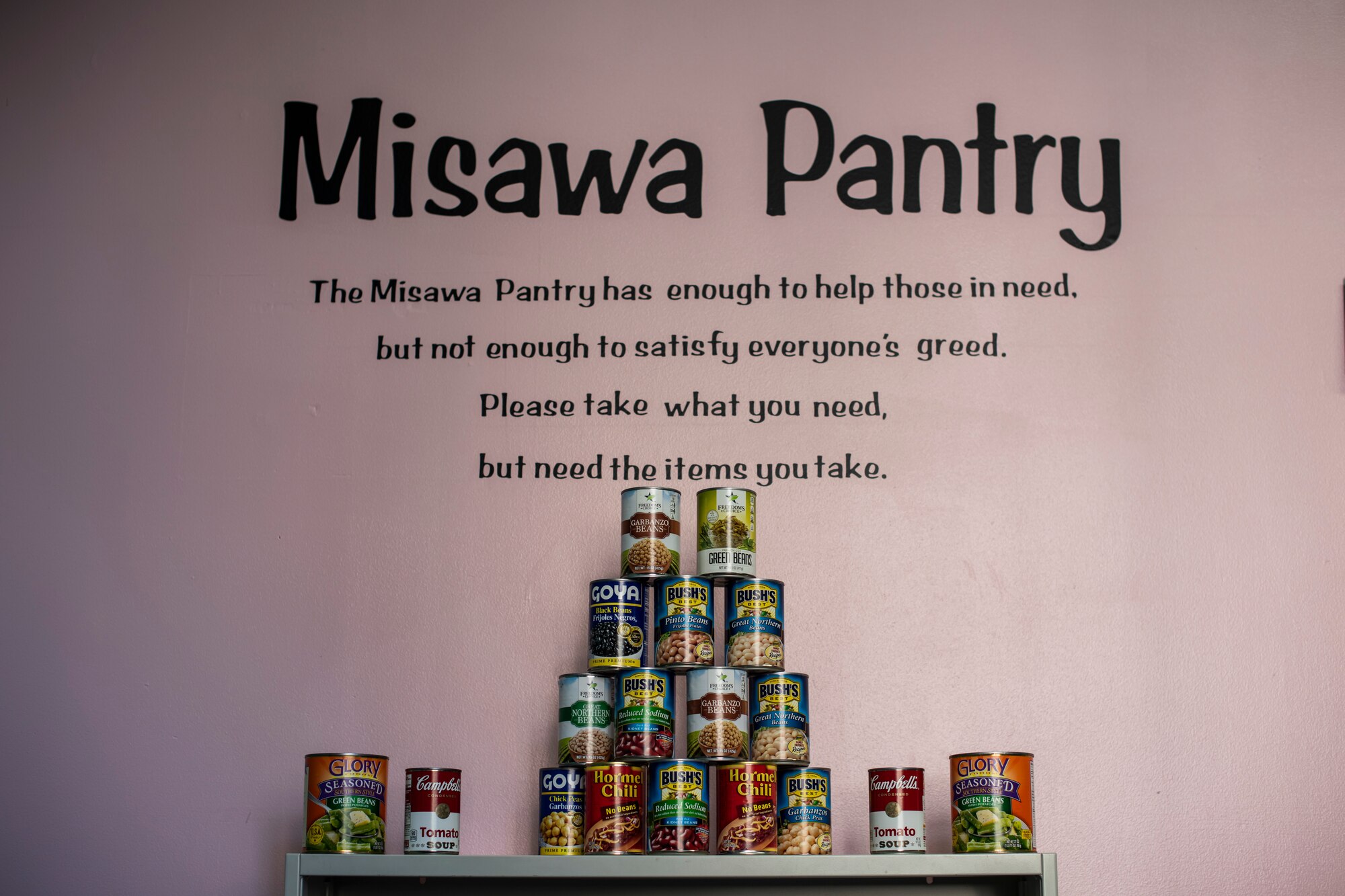 A pyramid of canned goods sit on a cabinet at the 35th Fighter Wing Pantry at Misawa Air Base, Japan, Nov. 1, 2019. The food pantry offers canned goods, giving active duty members and their families the opportunity to stock up on essential food items for free. (U.S. Air Force photo by Airman 1st Class China M. Shock)