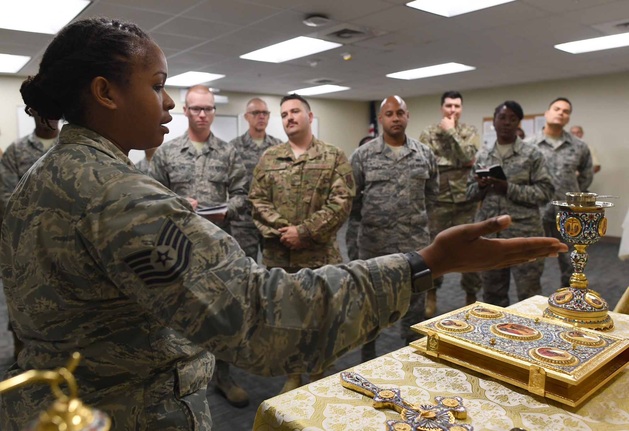 U.S. Air Force Tech. Sgt. Keesha Green, 335th Training Squadron religious affairs instructor, explains the Orthodox faith group set up during the religious affairs course inside Allee Hall at Keesler Air Force Base, Mississippi, Oct. 17, 2019. The six-week-long technical training course has been relocated and revamped to improve the training of their enlisted Airmen. (U.S. Air Force photo by Kemberly Groue)