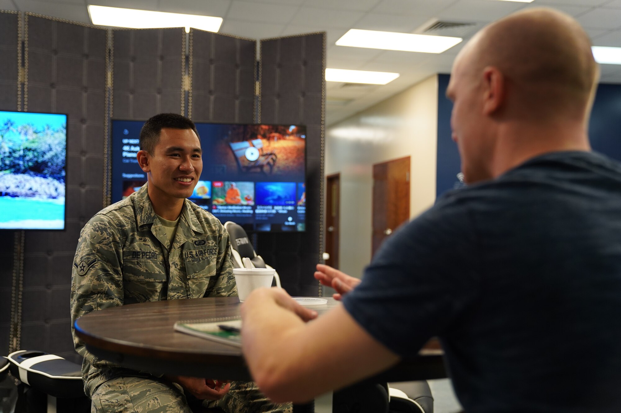 U.S. Air Force Airman John De Pedro, 81st Contract Squadron contract specialist, converses with a mentor during the first Leaders Influencing Together event inside the Larcher Chapel at Keesler Air Force Base, Mississippi, November 8, 2019.  The LIFT program pairs young and experienced Airmen together to build on various skills to improve the quality of their career. (U.S. Air Force photo by Airman 1st Class Spencer Tobler)