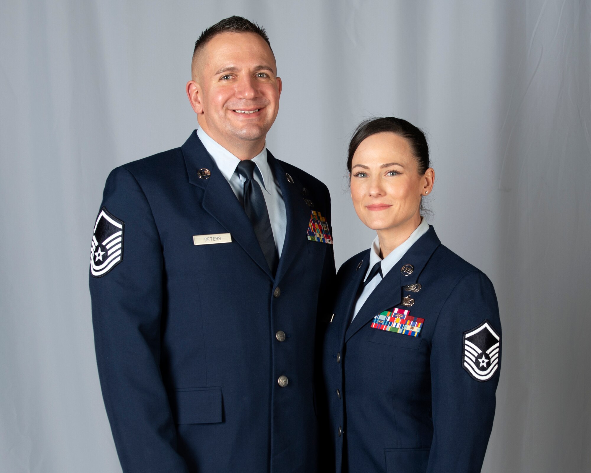 Alaska Air National Guard Master Sergeants Franz and Jessica Deters, pose for a photo at Joint Base Elmendorf-Richardson, Alaska, Nov. 7, 2019. Franz and Jessica are both assigned to the 176th Force Support Flight as a sustainment services superintendent and installation personnel readiness specialist respectively. The Deters, who married in 2012, transitioned to the ANG after serving in the U.S. Marine Corps.