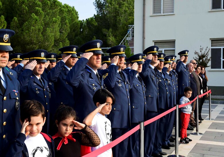 Members of the Turkish air force and their children render salutes during the Ataturk Memorial Day Ceremony Nov. 10, 2019, at Incirlik Air Base, Turkey. The ceremony was open to base personnel and families to remember Ataturk’s brave history and the future and pride of Turkey.