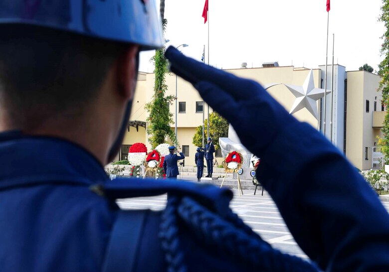 A member of the Turkish air force salutes a monument of Mustafa Kemal Ataturk during the Ataturk Memorial Day Ceremony Nov. 10, 2019, at Incirlik Air Base, Turkey. In recognition of his cultural and socio-political reforms, Mustafa Kemal was given the last name Ataturk which means “father of Turks.”