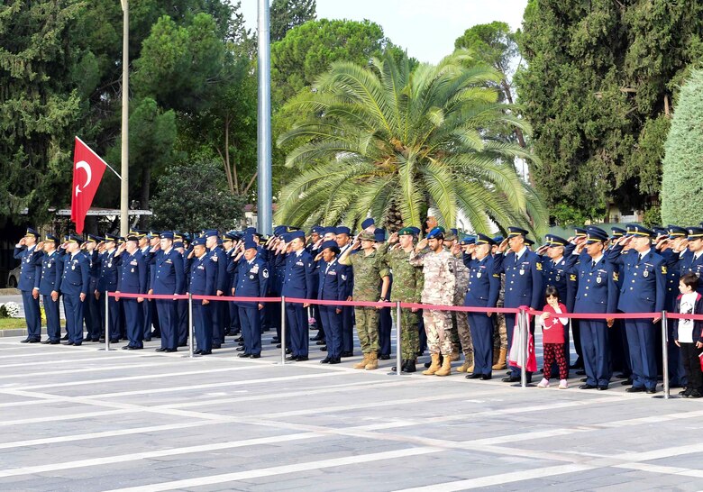 U.S., Turkish, Spanish, Qatari service members from across the base render a salute during the Ataturk Memorial Day Ceremony Nov. 10, 2019, at Incirlik Air Base, Turkey. The ceremony brought members from across the base together to honor Ataturk, the founder and first president of modern Turkey.
