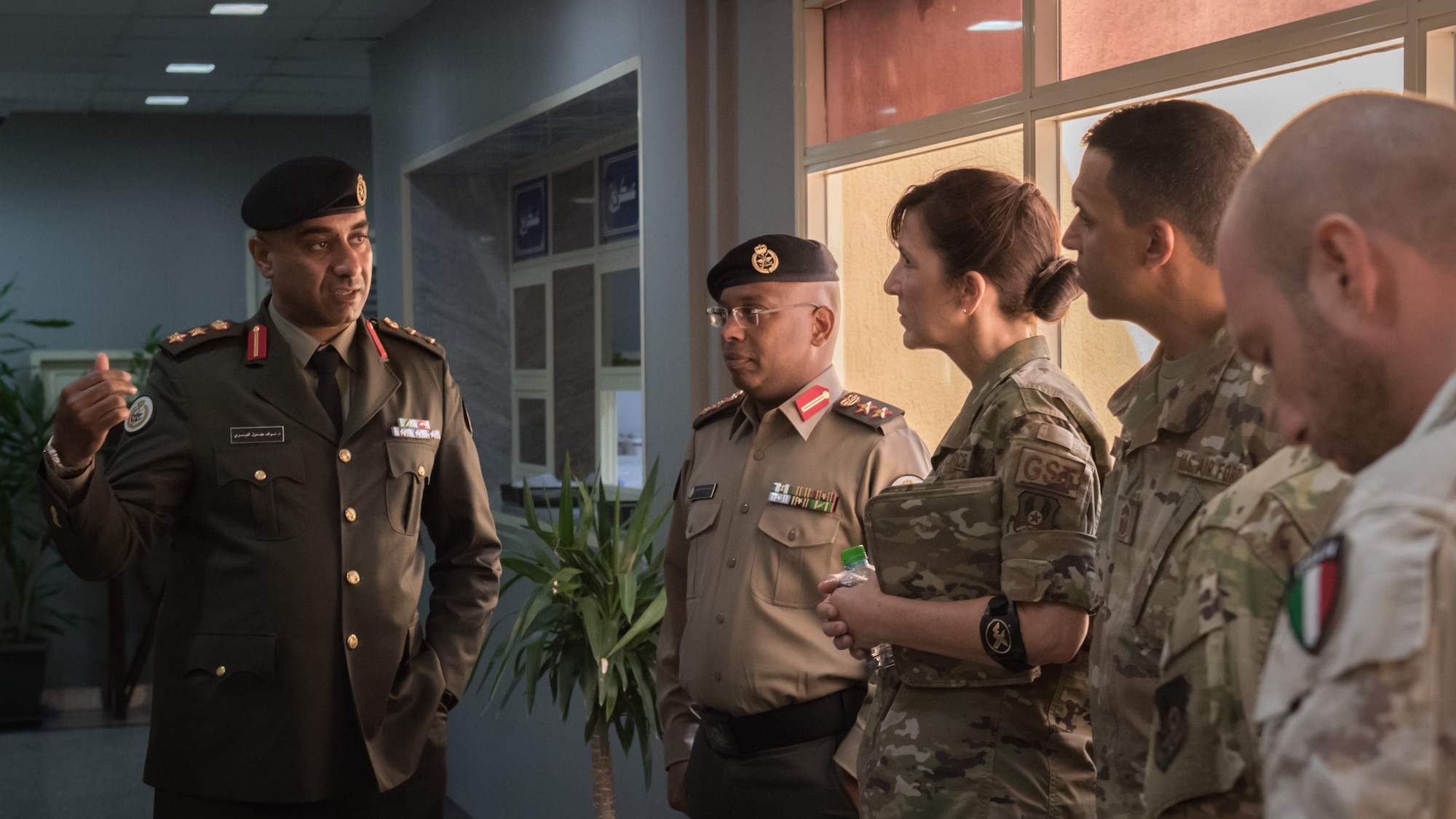 Leadership and staff members from the 386th Expeditionary Medical Group receive a tour of the Kuwaiti army's North Military Medical Complex in Al Jahra, Kuwait, Nov. 7, 2019.  Left to right: Kuwait army Col. Nawaf Jandoul Al-Dousari, North Military Medical Complex director; Kuwaiti army Col. Homoud Alenezi, North Military Medical Complex assistant director; U.S. Air Force Col. Courtney Finkbeiner, 386th EMDG commander; U.S. Air Force Chief Master Sgt. Alan Weary, 386th EMDG superintendent; Italian air force Lt. Salvatore Napolitano,Task Force Air-Kuwait flight surgeon. (U.S. Air Force photo by Tech. Sgt. Daniel Martinez)
