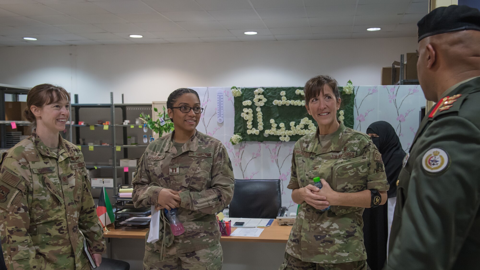 Kuwaiti army Col. Nawaf Jandoul Al-Dousari, North Military Medical Complex director, right, speaks with 386th Expeditionary Medical Group staff members Maj. Brooke Sciuto, Capt. Deidre Cooperwood and 386th EMDG commander, Col. Courtney Finkbeiner during a tour of the medical facility in Al Jahra, Kuwait, Nov. 7, 2019. Kuwaiti army medics and leadership hosted Airmen from the 386th Expeditionary Medical Group providing a tour of the facility and inviting them to take part in a presentation for a continuiting medical education exchange. (U.S. Air Force photo by Tech. Sgt. Daniel Martinez)