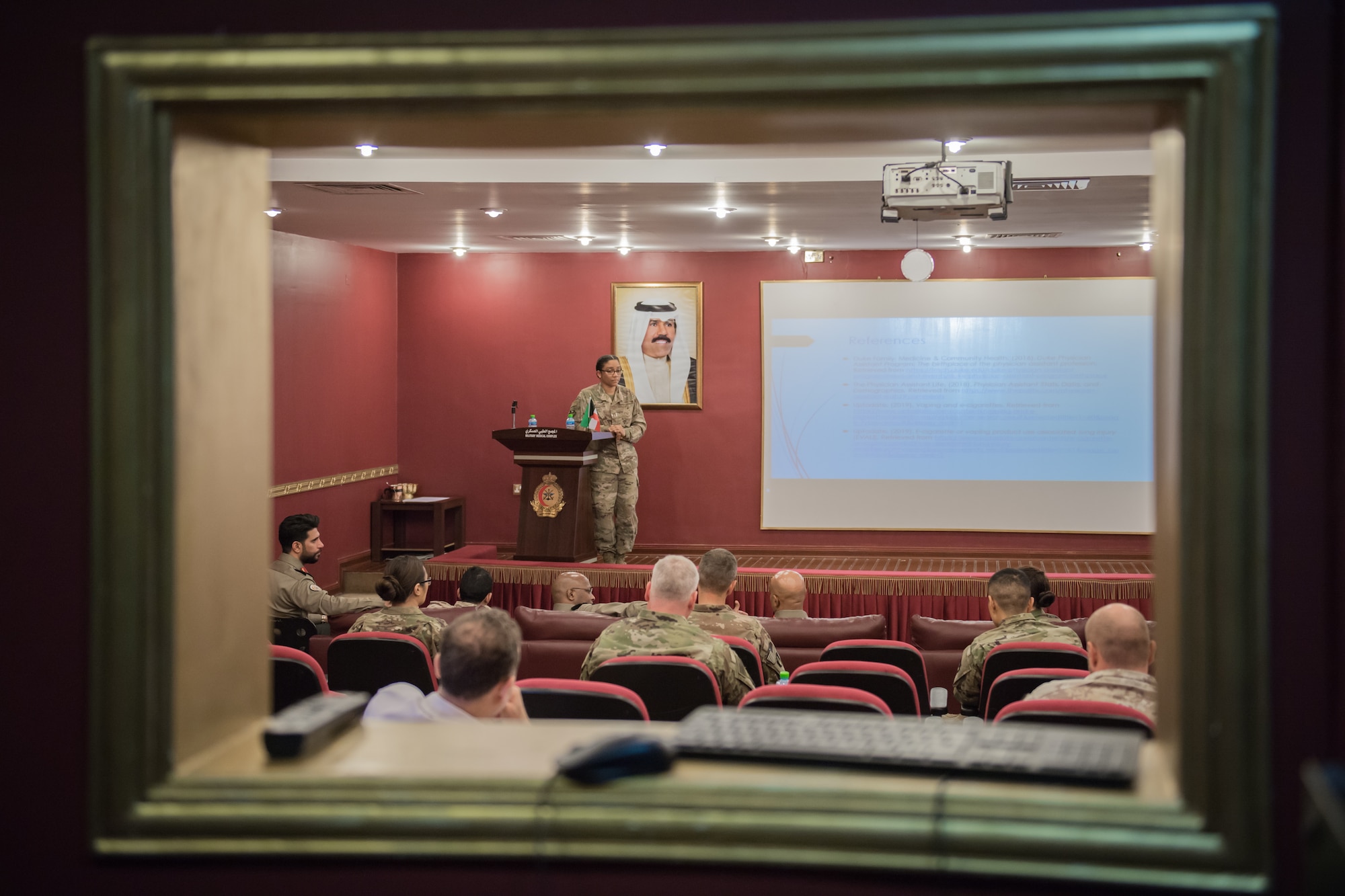 U.S. Air Force Capt. Deidre Cooperwood, right, 386th Expeditionary Medical Group physician assistant, briefs Kuwaiti army medical facility staff members and U.S. Army medical experts from Camp Arifjan during a continuing medical education exchange at the North Military Medical Complex in Al Jahra, Kuwait, Nov. 7, 2019. Kuwaiti army medics and leadership hosted Airmen from the 386th Expeditionary Medical Group providing a tour of the facility and inviting them to take part in a presentation for a continuiting medical education exchange. (U.S. Air Force photo by Tech. Sgt. Daniel Martinez)