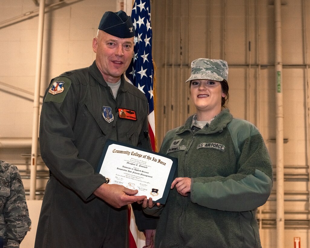 Woman receiving diploma.