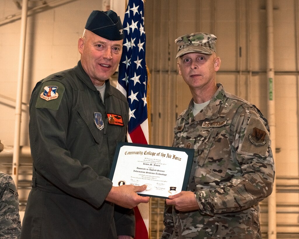 Man receiving diploma.