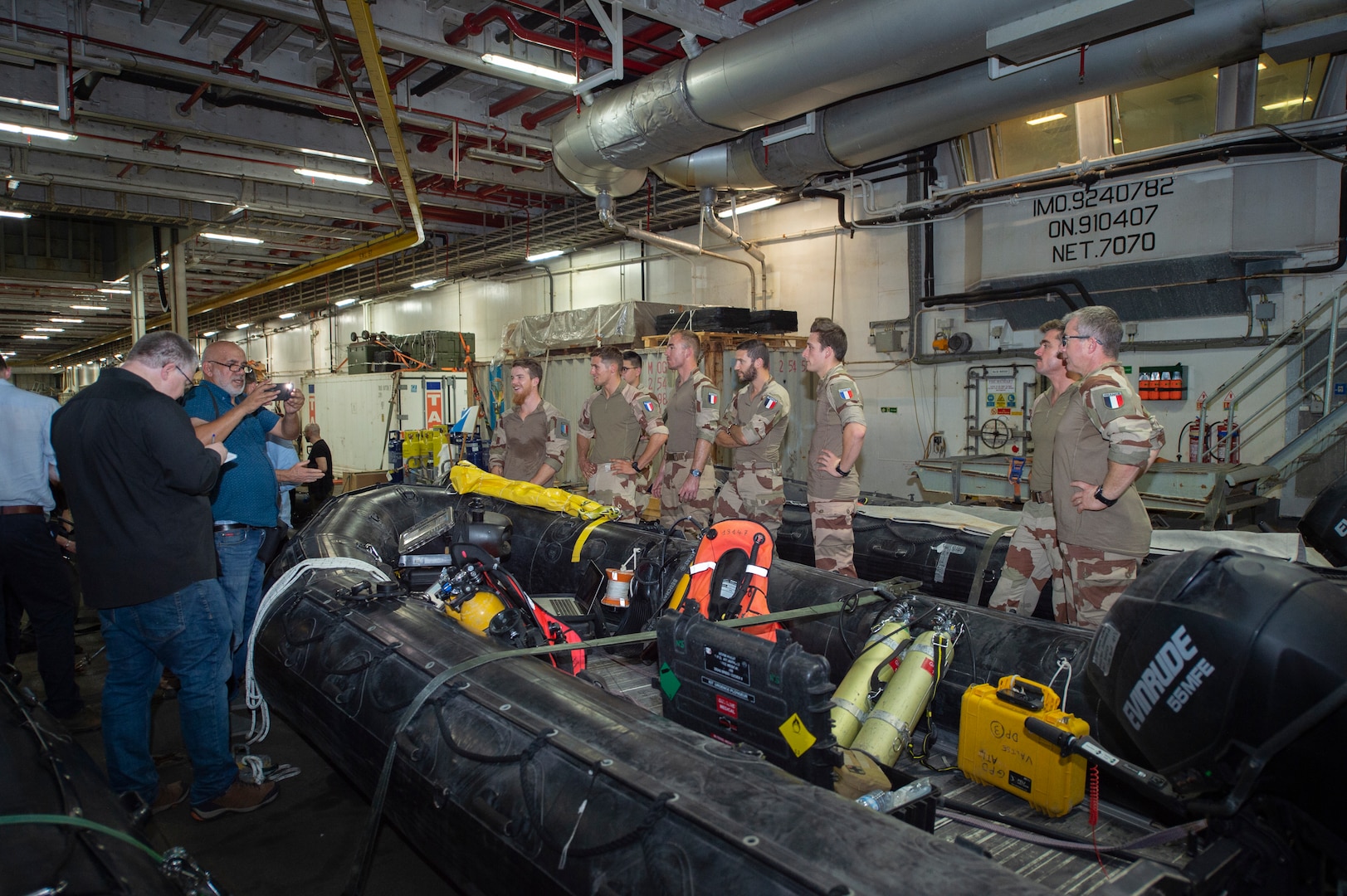 Civilian Journalists discuss divers’ roles in Mine Counter Measures (MCM) during the International Maritime Exercise 2019 (IMX 19), with the French navy divers. The exercise is a multinational engagement involving partners and allies from around the world designed to facilitate the sharing of knowledge and experiences across the full spectrum of defensive maritime operations. IMX 19 serves to demonstrate the global resolve in maintaining regional security and stability, freedom of navigation and the free flow of commerce from the Suez Canal south to the Bab el-Mandeb Strait through the Strait of Hormuz to the Northern Arabian Gulf. (U.S. Navy photo by Mass Communication Specialist 3rd Class Darienne Slack