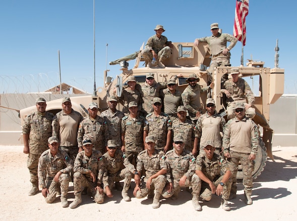 Soldiers of the Jordan Armed Forces (JAF), 81st Quick Reaction Force (QRF) and Bravo Company, 1st Battalion, 68th Armor Regiment, 3rd Armored Brigade Combat Team, 4th Infantry Division, Task Force Spartan stand together with one of the M-ATV’s they trained on in celebration of completing their partnership training. (U.S. Army photo by Maj. David L. Zuzak)