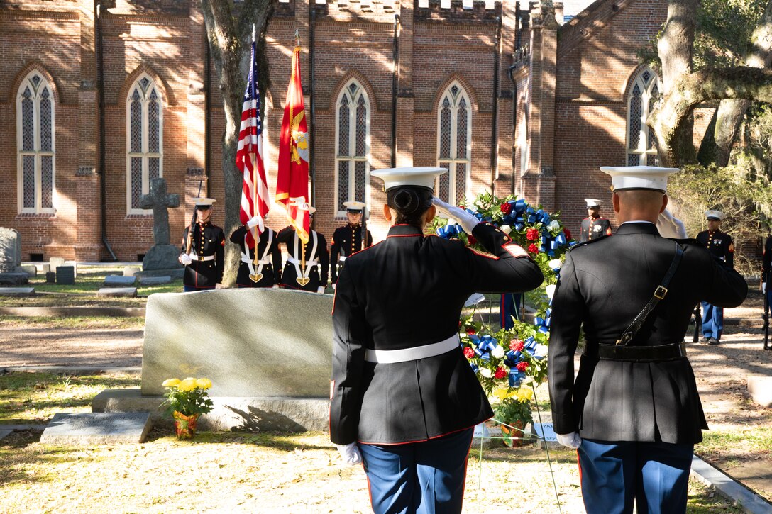 Col. Walker Field, chief of staff of Marine Forces Reserve, and 1st Sgt. Sigrid Rivera, company first sergeant, salute the colors during the national anthem at a wreath laying ceremony at Grace Episcopal Church, Saint Francisville, Louisiana Nov. 10, 2019. The Marines of Truck Company traveled 125 miles in order to carry out the ceremony. (U.S. Marine Corps photo by Lance Cpl. Christopher England)