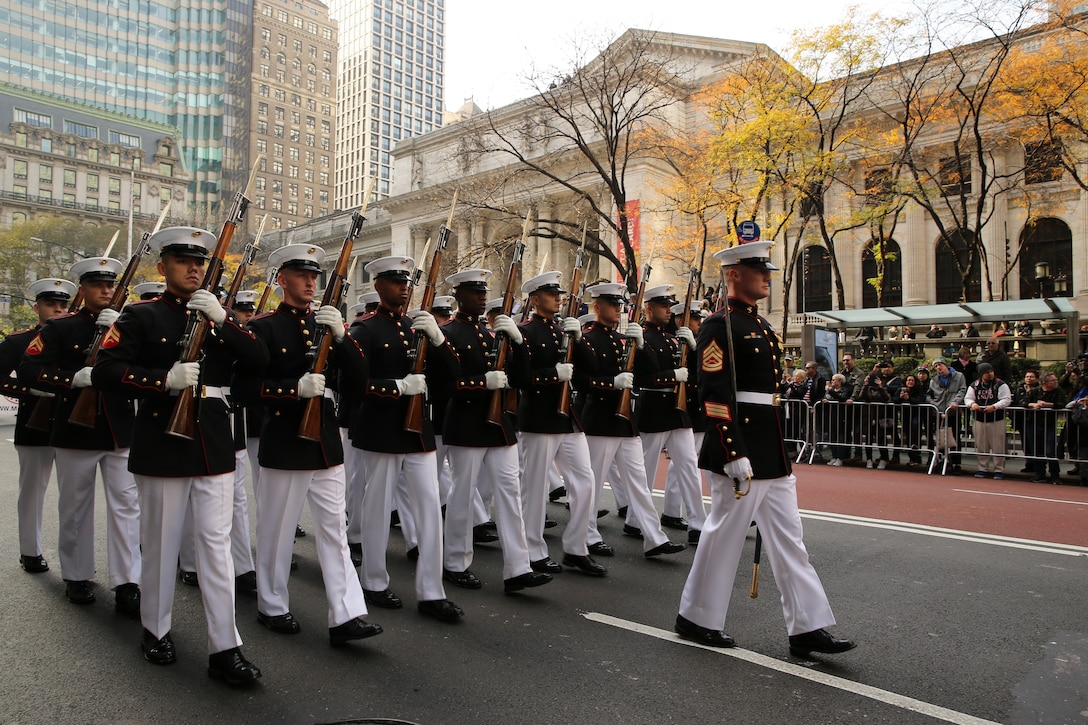 Marines with the U.S. Marine Corps Silent Drill Platoon march in formation during the 2019 Veteran’s Day Parade in New York, New York, Nov. 11, 2019. The Veteran’s Day Parade is hosted annually to commemorate the service and sacrifice of service members and their families.