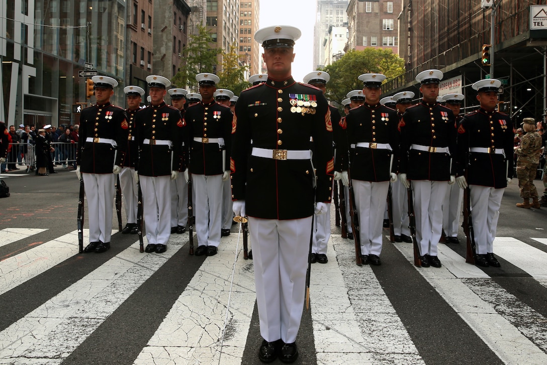 Marines with the U.S. Marine Corps Silent Drill Platoon stand at attention during the 2019 Veteran’s Day Parade in New York, New York, Nov. 11, 2019. The Veteran’s Day Parade is hosted annually to commemorate the service and sacrifice of service members and their families.