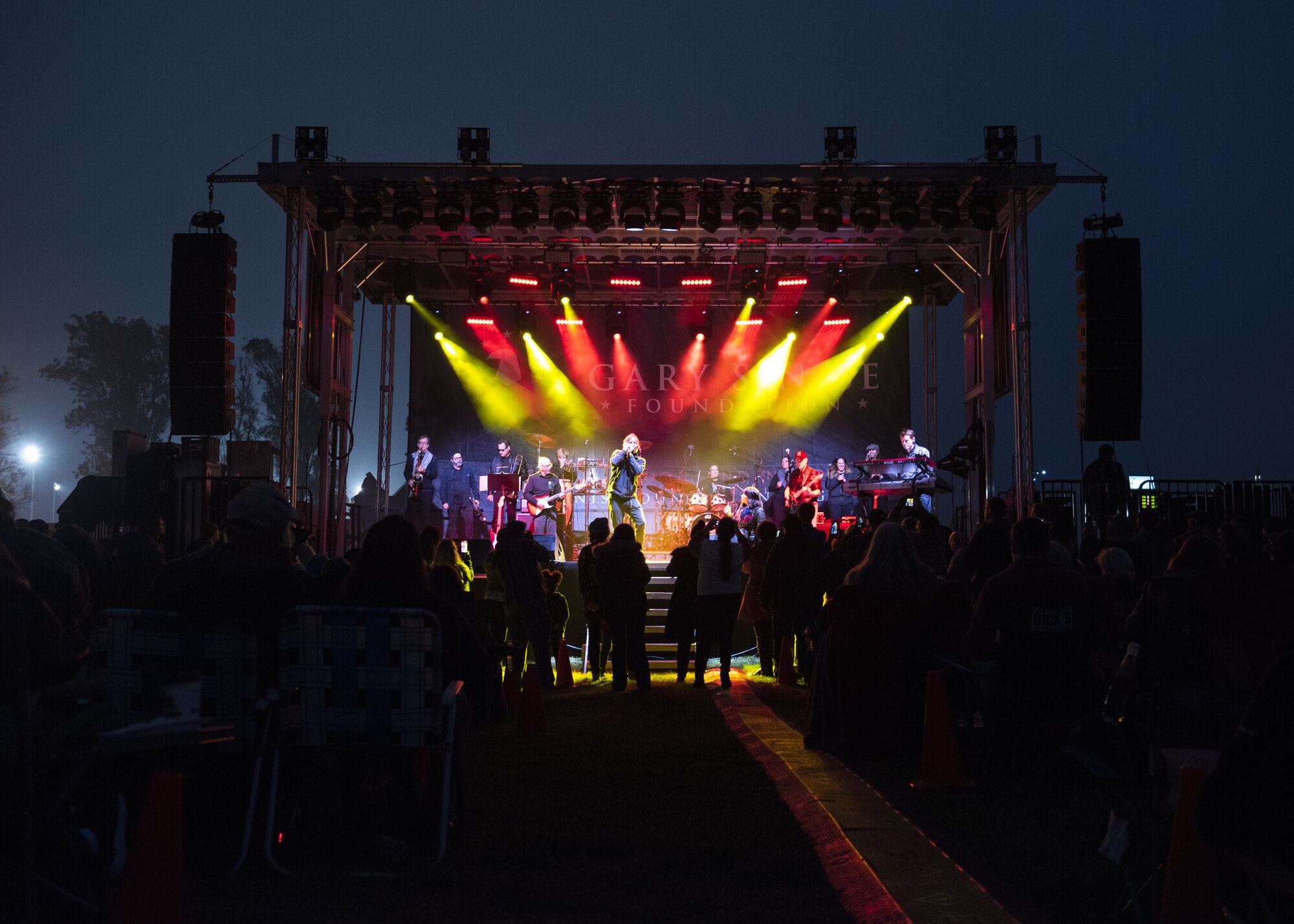 Members of Vandenberg Air Force Base attend a Gary Sinise and the Lt. Dan Band concert as part of a military appreciation event, Nov. 8, 2019 at Vandenberg AFB, Calif. The band performed at Vandenberg AFB, where they emphasized their support to organizations that are working for veterans, wounded service members and their families. (U.S. Air Force photo by Airman 1st Class Aubree Milks)