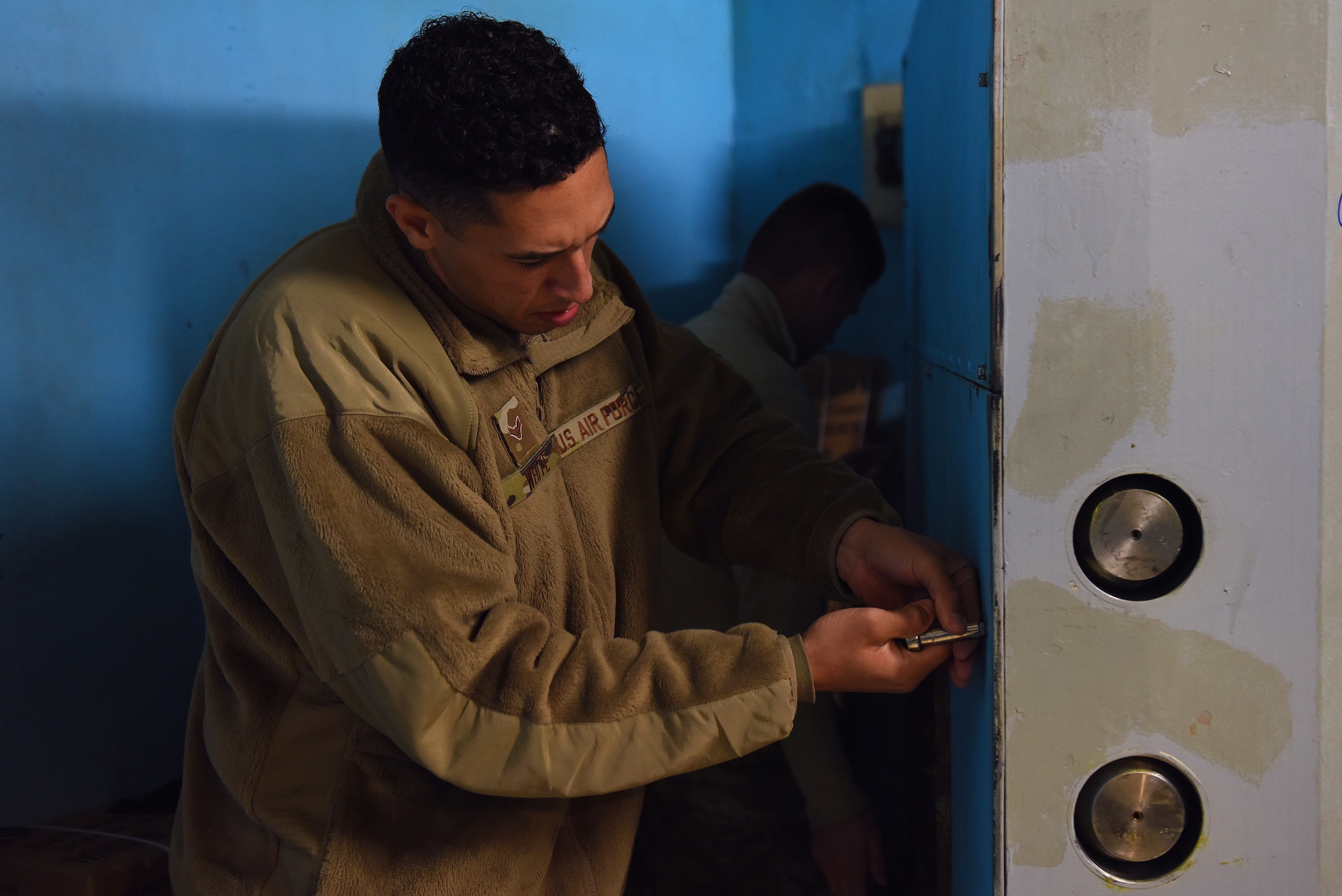 Airman 1st Class Anthony White, 341st Missile Maintenance Squadron survivable systems team member, performs maintenance on a launch control center blast door Oct. 29, 2019, at a Missile Alert Facility near Malmstrom Air Force Base, Mont.