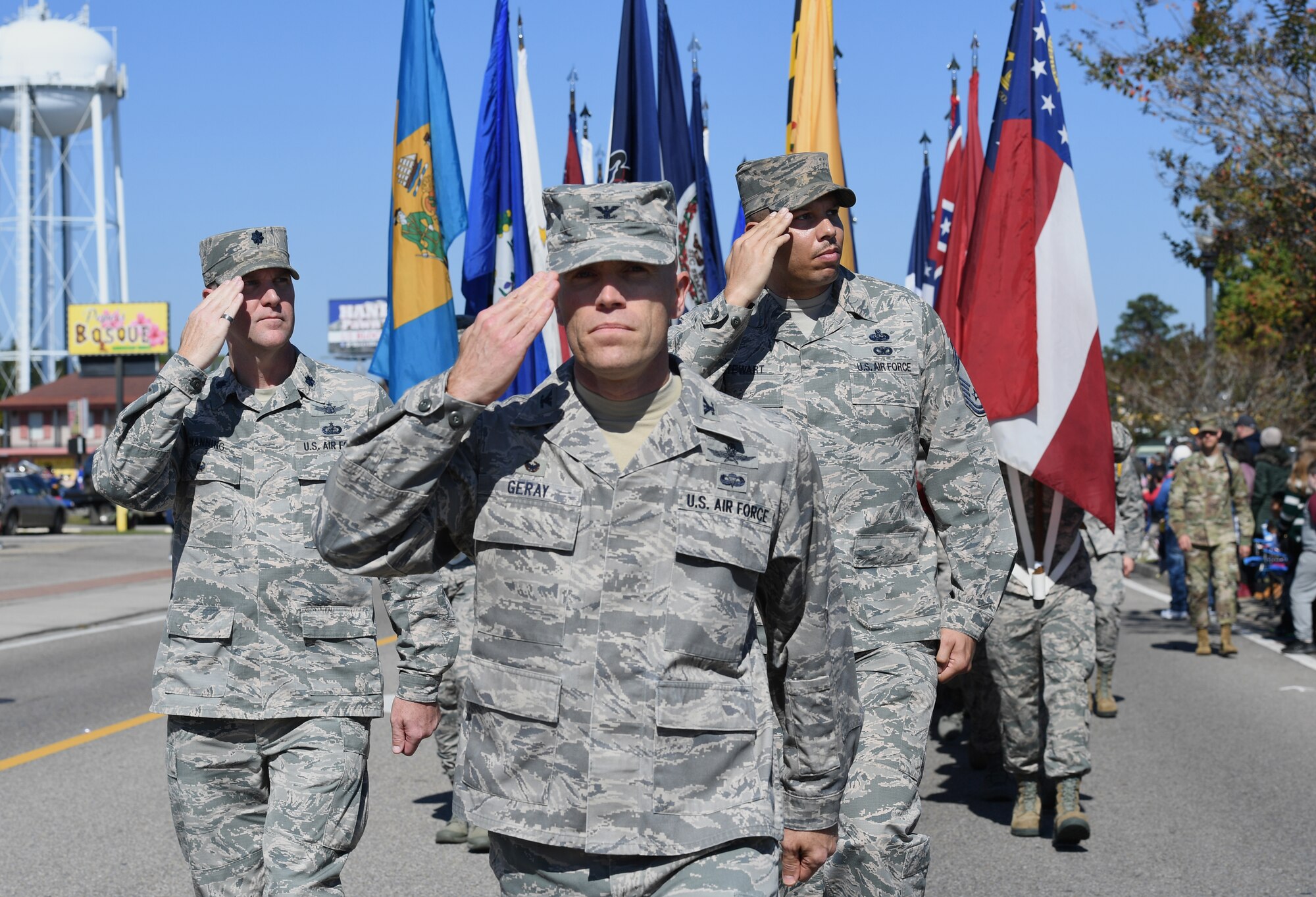 U.S. Air Force Col. Chance Geray, 81st Training Group commander, (center), Lt. Col. Michael Manning, 81st TRG deputy commander, and Chief Master Sgt. Timothy Stewart, 81st Training Support Squadron superintendent, march in the 19th Annual Gulf Coast Veterans Day Parade in DíIberville, Mississippi, Nov. 9, 2019. Keesler Air Force Base leadership, along with hundreds of Airmen, attended and participated in the parade in support of all veterans past and present. More than 70 unique floats, marching bands and military units marched in the largest Veterans Day parade on the Gulf Coast. (U.S. Air Force photo by Kemberly Groue)