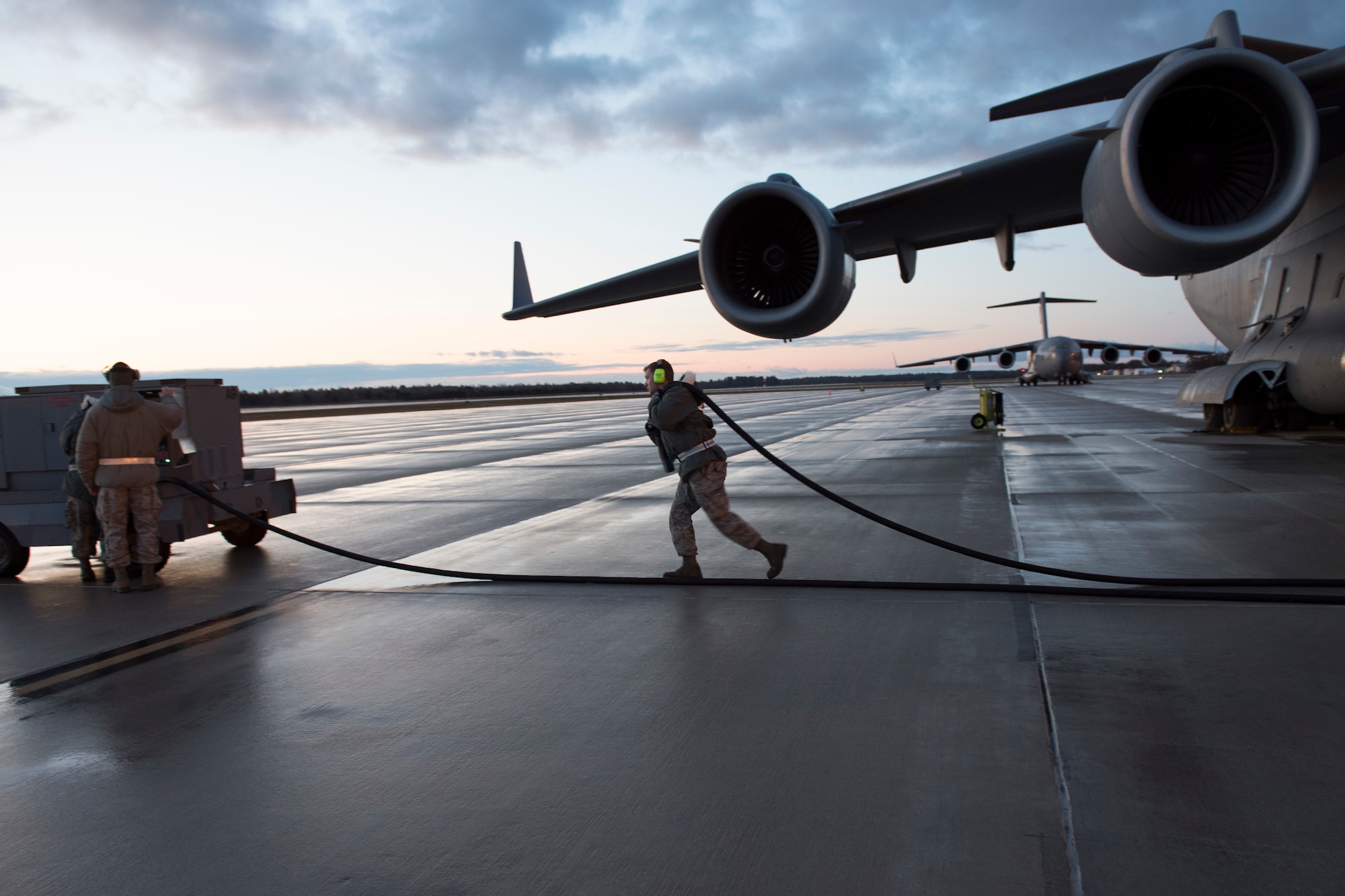 167th Airlift Wing aircraft maintainers ready C-17 Globemaster III aircraft for launch during a full-scale readiness exercise, Nov. 5, 2019. iApproximately 300 members of the 167th Airlift Wing deployed to the Combat Readiness Training Center in Alpena, Mich., Nov. 3-7, for the event. (U.S. Air National Guard photo by Senior Master Sgt. Emily Beightol-Deyerle)