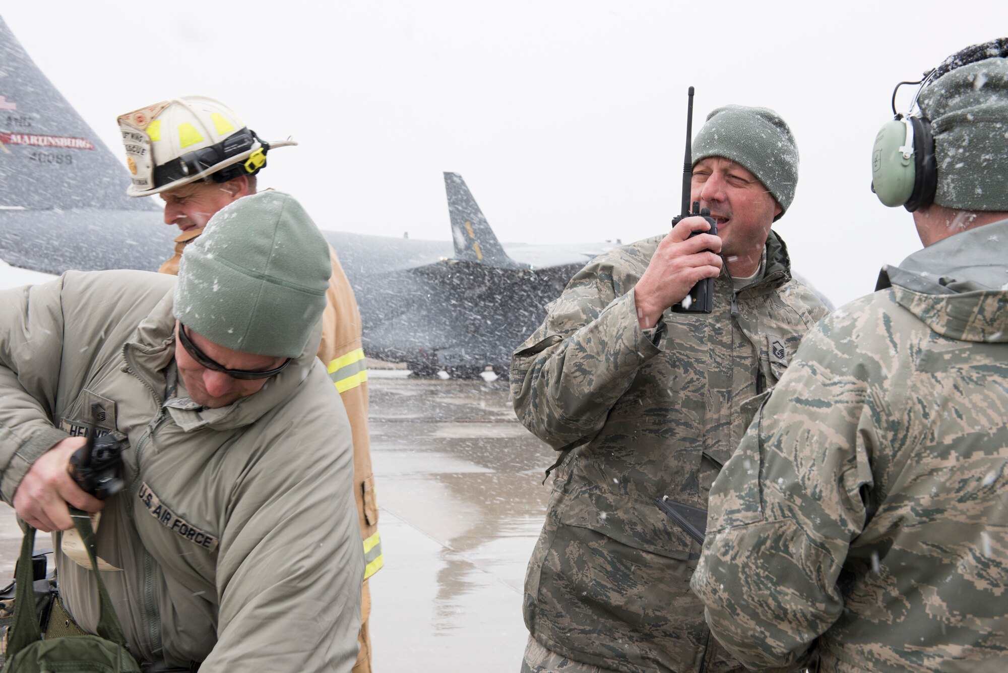 Master Sgt. Christopher Sheldon, 167th Airlift Wing aircraft mechanic, makes a call on his radio during a  full-scale readiness exercise, Nov. 5, 2019. Approximately 300 members of the 167th Airlift Wing deployed to the Combat Readiness Training Center in Alpena, Mich., Nov. 3-7, for the event. (U.S. Air National Guard photo by Senior Master Sgt. Emily Beightol-Deyerle)