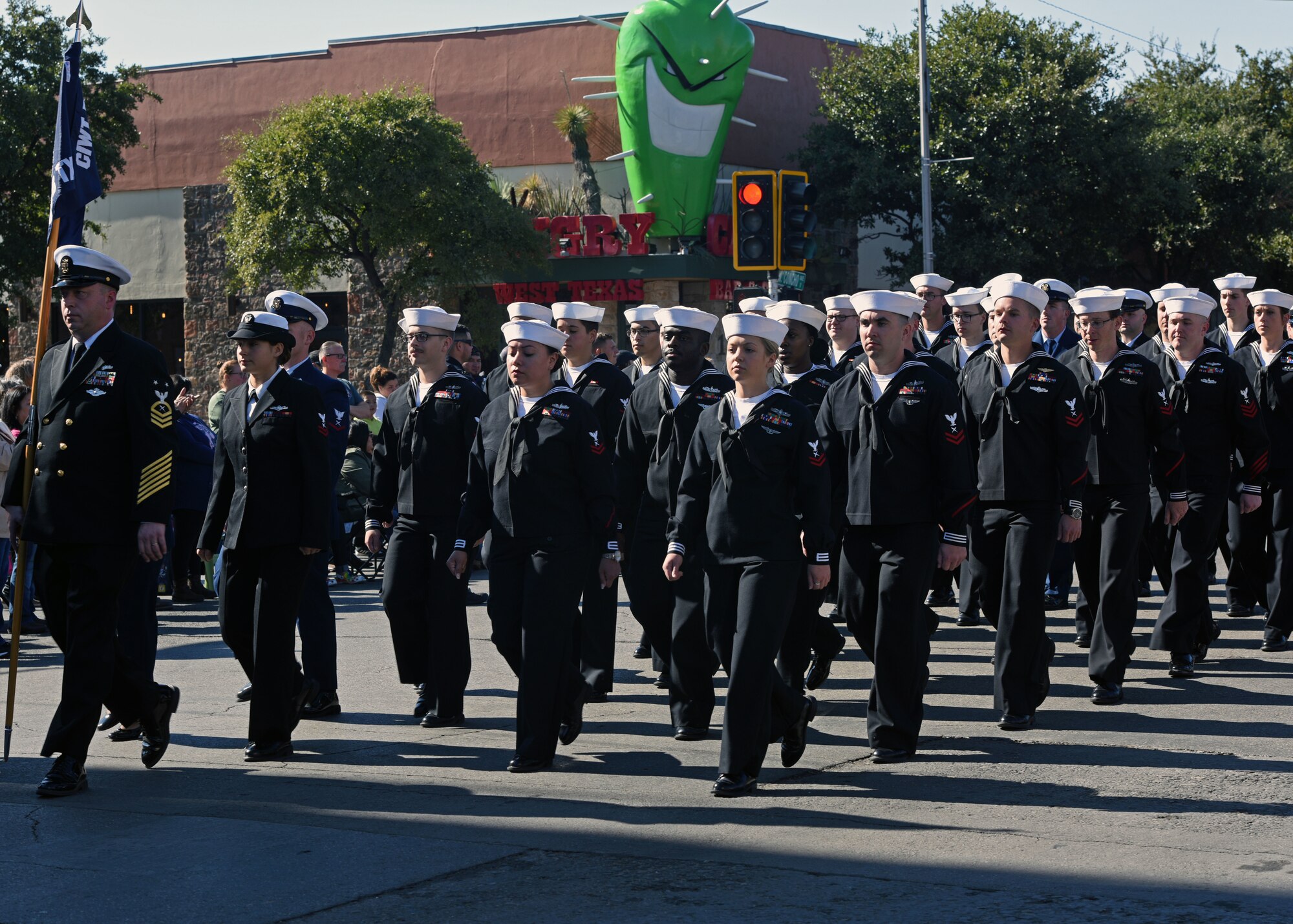 U.S. Navy sailors stationed at Goodfellow Air Force Base, march during the Veterans Day Parade in San Angelo, Texas, Nov. 9, 2019. All branches of the U.S. Armed Forces were represented throughout the parade to honor all those who have served. (U.S. Air Force photo by Airman 1st Class Robyn Hunsinger/Released)