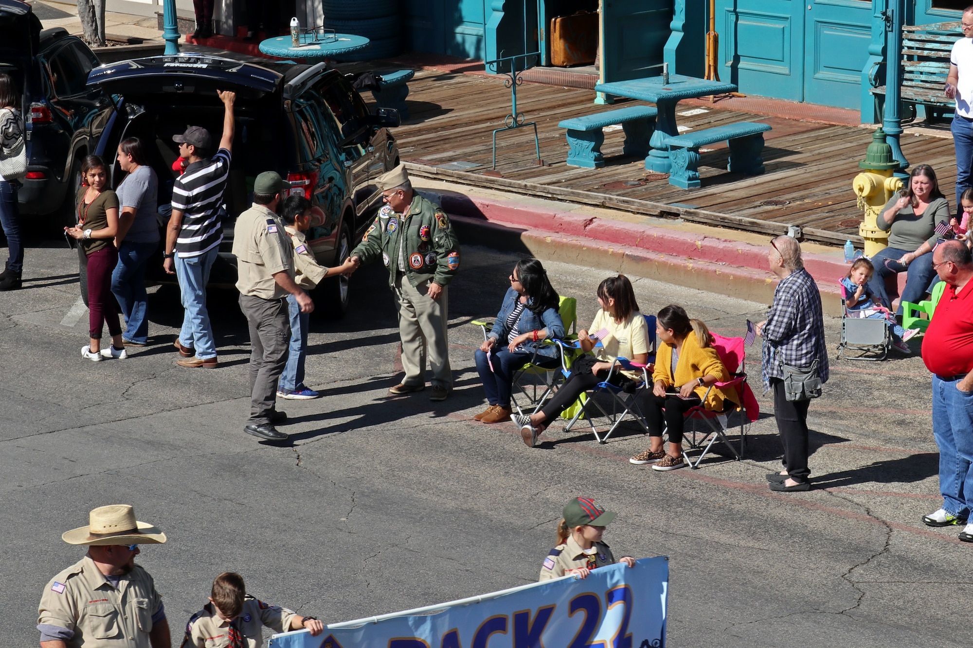 A cub scout from San Angelo Pack 22 thanks a veteran during the Veterans Day Parade in San Angelo, Texas, Nov. 9, 2019. The parade featured military members from Goodfellow Air Force Base, local organizations and schools. (U.S. Air Force photo by Airman 1st Class Zachary Chapman/Released)