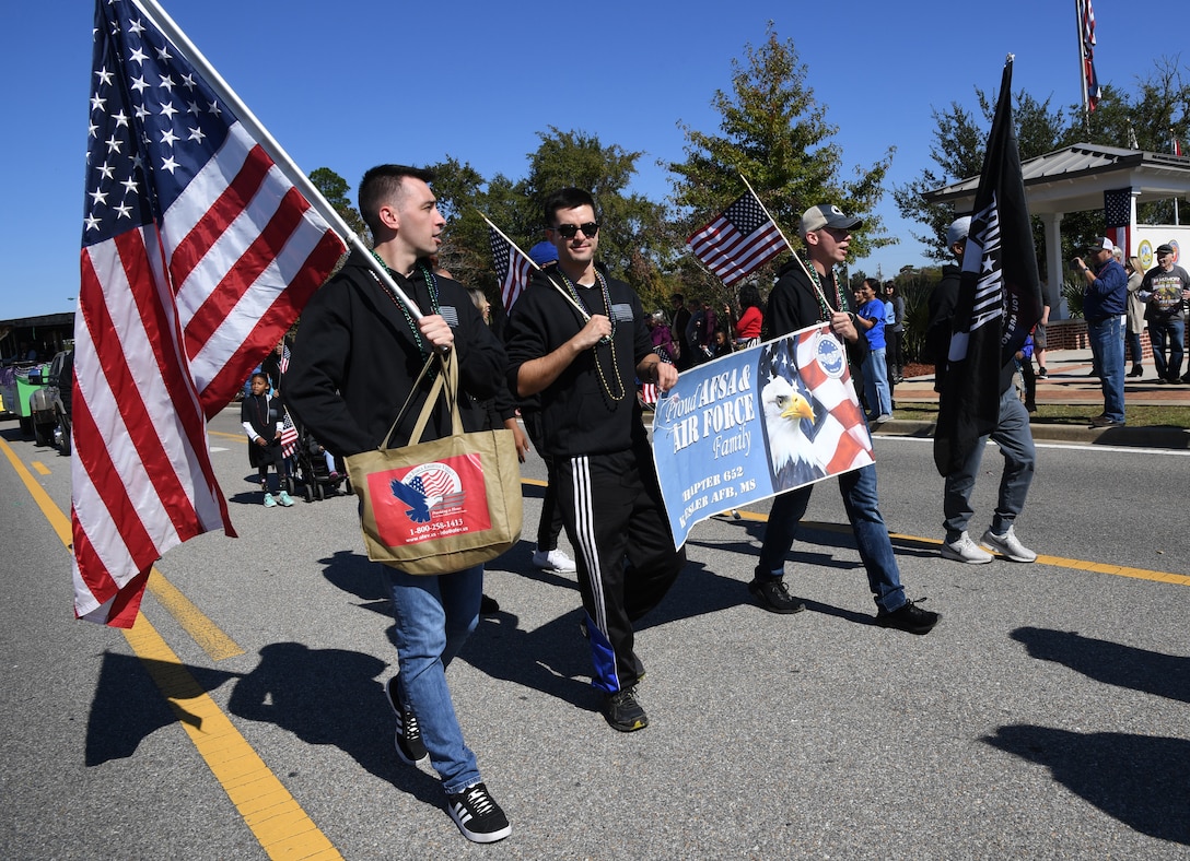 Air Force Sergeants Association members march in the 19th Annual Gulf Coast Veterans Day Parade in DíIberville, Mississippi, Nov. 9, 2019. Keesler Air Force Base leadership, along with hundreds of Airmen, attended and participated in the parade in support of all veterans past and present. More than 70 unique floats, marching bands and military units marched in the largest Veterans Day parade on the Gulf Coast. (U.S. Air Force photo by Kemberly Groue)
