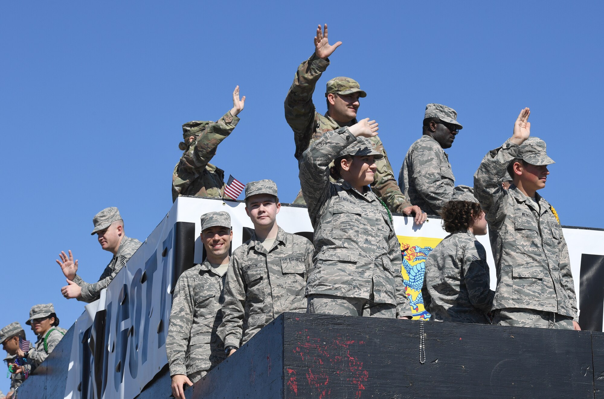 Airmen from the 81st Training Group ride in a float during the 19th Annual Gulf Coast Veterans Day Parade in DíIberville, Mississippi, Nov. 9, 2019. Keesler Air Force Base leadership, along with hundreds of Airmen, attended and participated in the parade in support of all veterans past and present. More than 70 unique floats, marching bands and military units marched in the largest Veterans Day parade on the Gulf Coast. (U.S. Air Force photo by Kemberly Groue)