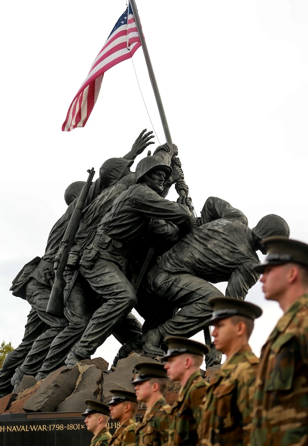 Marines with Marine Barracks Washington stand at the position of attention during a parade rehearsal at the Marine Corps War Memorial, Arlington, Virginia, Nov. 7, 2019. The Marines rehearsed for the annual wreath laying ceremony. (U.S. Marine Corps photo by Cpl. James Bourgeois.)