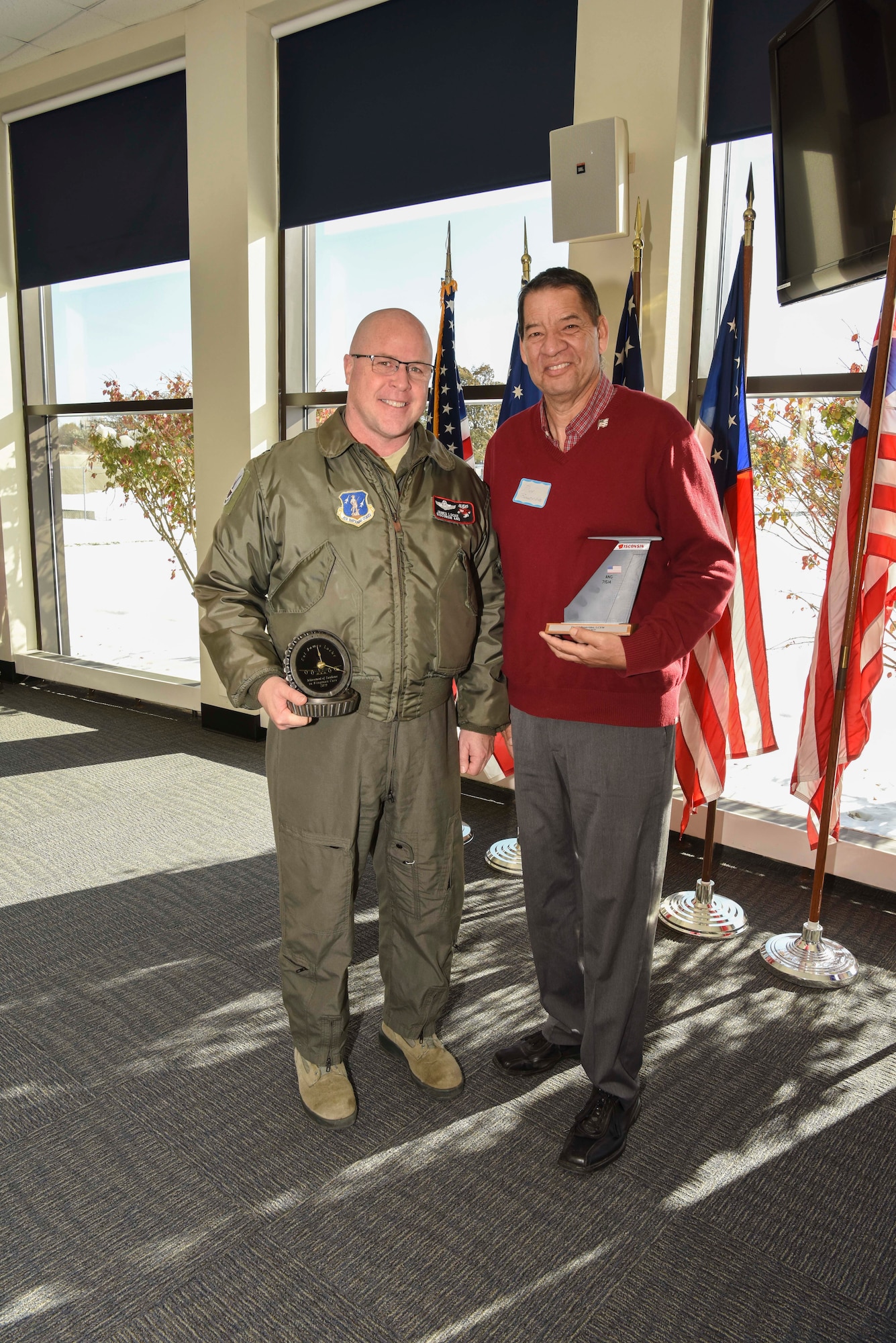 Col. James Locke, 128th Air Refueling Wing Commander, and Daniel Benavides, LCSW licensed clinical social worker from Summit Psychology Clinic, were presented with an ‘Achievement of Excellence in Wingman Care’ award here Milwaukee, Nov. 12, 2019. The 128th Air Refueling Wing hosted the Bi-Annual Community Commanders Call on behalf of Zablocki Veterans Affairs and Milwaukee Vet Center 12 Nov. 2019 at Sijan Hall, General Mitchell Air National Guard Base