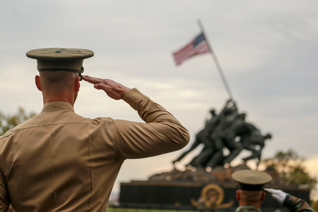 Colonel Donald J. Tomich, commanding officer, Marine Barracks Washington, D.C., renders a salute during a parade rehearsal at the Marine Corps War Memorial, Arlington, Virginia, Nov. 7, 2019. The Marines rehearsed for the annual wreath laying ceremony. (U.S. Marine Corps photo by Cpl. James Bourgeois.)