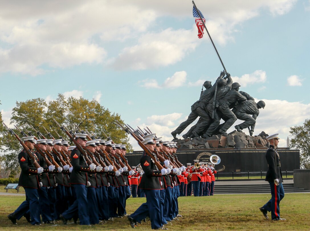 Marines with Marine Barracks Washington perform during a Wreath Laying Ceremony at the Marine Corps War Memorial Arlington, Virginia, Nov. 8, 2019. Small teams of Marines also visited several gravesites of former commandants of the Marine Corps to render honors to these Marines. These ceremonies are held to celebrate these Marines’ love and devotion to their Corps and Country, and to celebrate the Marine Corps birthday. (U.S. Marine Corps photo by Cpl. James Bourgeois)
