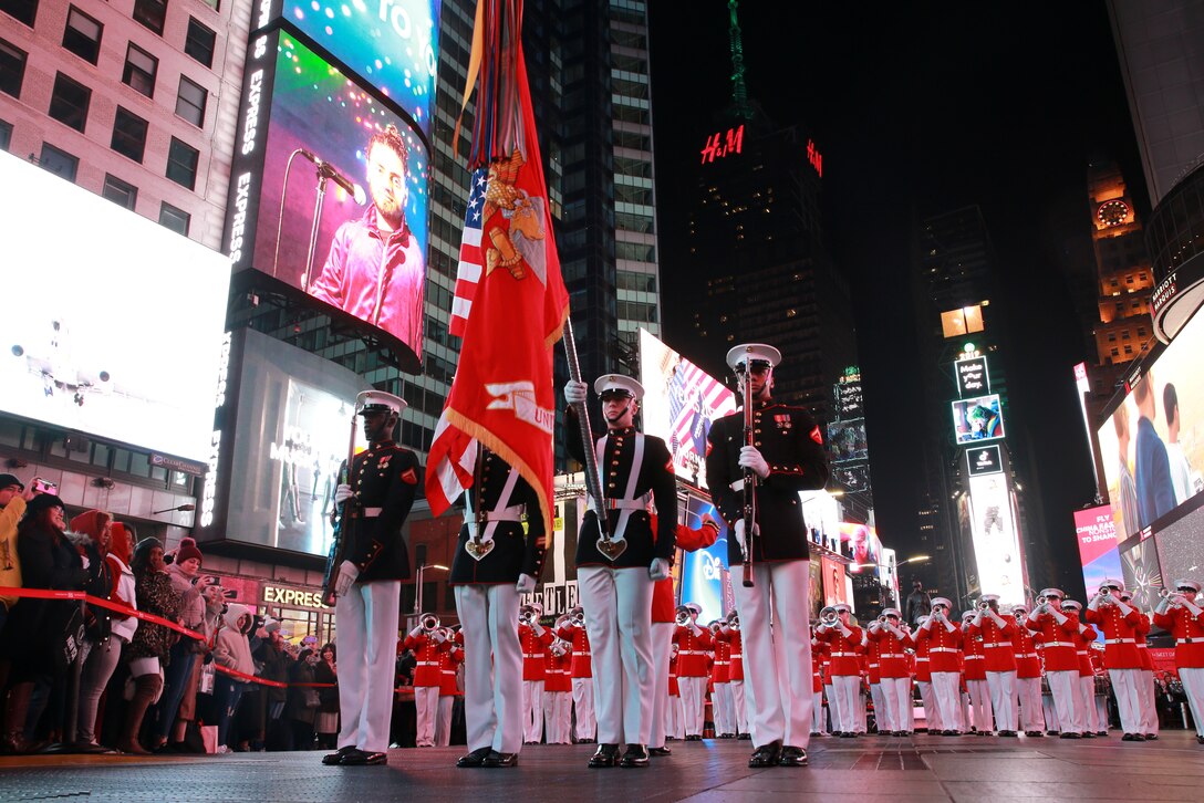 Marines with the U.S. Marine Corps Color Guard present the National Ensign during the performance at Times Square, New York, New York, Nov. 10, 2019. The Marines from the Battle Color Detachment, Marine Barracks Washington D.C., performed at Times Square in honor of the Marine Corps’ 244th Birthday.
