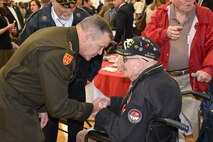 Lt. Gen. James H. Dickinson, commanding general, U.S. Army Space and Missile Defense Command, thanks World War II veteran Sherwin Callander for his service during the 14th annual Veterans Prayer Breakfast at the Hogan YMCA in Madison, Alabama, Nov 8. (U.S. Army photo by Jason B. Cutshaw)