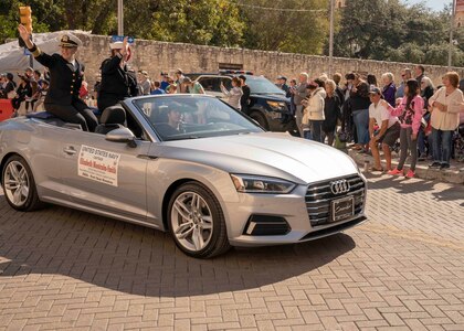 Capt. Elizabeth Montcalm-Smith (left), acting deputy commander of Navy Medicine Education, Training and Logistics Command, and Petty Officer 1st Class Amity Montoya, NMETLC’s Sailor of the Year, waive to the crowd during the 2019 U.S. Military Veterans Parade through downtown San Antonio Nov. 11.