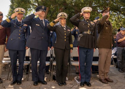 Capt. Elizabeth Montcalm-Smith (center), acting deputy commander of Navy Medicine Education, Training and Logistics Command, joined by other local service leaders, salutes for the playing of taps during the 2019 U.S. Military Veterans Wreath-laying Ceremony at the Alamo.