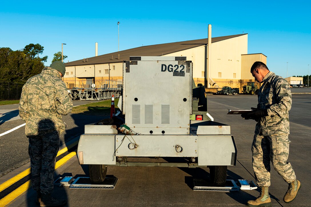 Airmen assigned to the 23d Logistics Readiness Squadron (LRS) measure cargo weight during exercise FT 20-01 Nov. 13, 2019, at Moody Air Force Base, Ga. FT 20-01 is a force generation exercise designed to validate the 23d Wing's ability to deploy the 75th Fighter Squadron in support of contingency operations. The 23d LRS conducted a staging area for cargo and equipment where they ensured all resources were properly weighed prior to being loaded onto a simulated aircraft. (U.S. Air Force photo by Senior Airman Erick Requadt)